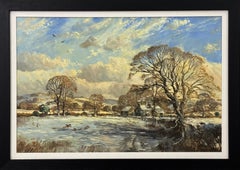 Winter landscape with snow covered fields & farmhouse in the English Countryside