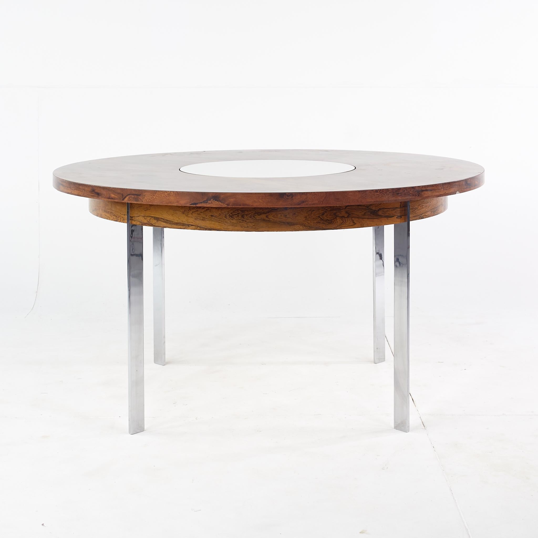 Richard Young mid century round rosewood lazy susan dining table

This dining table measures: 54 wide x 54 deep x 29 inches high, with chair clearance of 25 inches

All pieces of furniture can be had in what we call restored vintage condition.