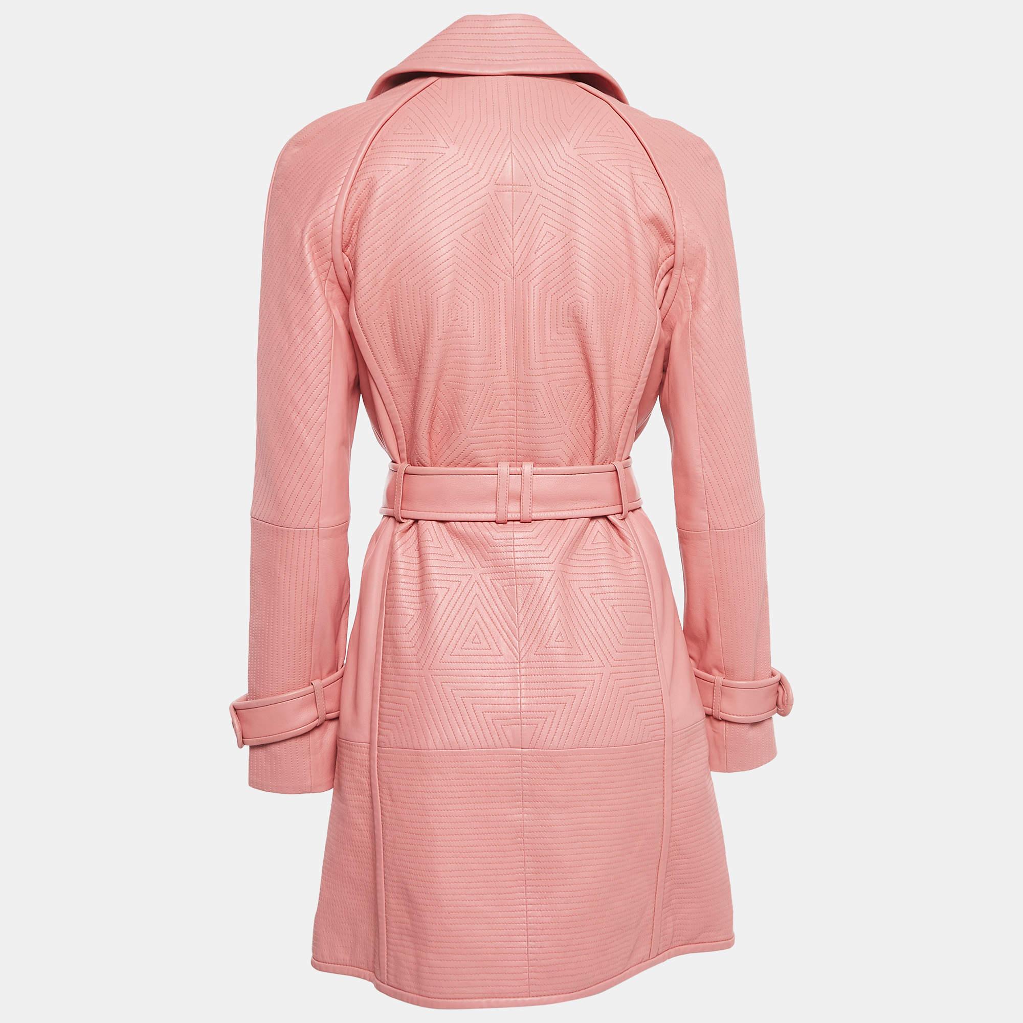 The Richards Radcliffe trench coat exudes sophistication with its luxurious pink leather and timeless double-breasted design. Its sleek silhouette, wide lapels, and waist belt combine for a statement piece that effortlessly blends classic elegance