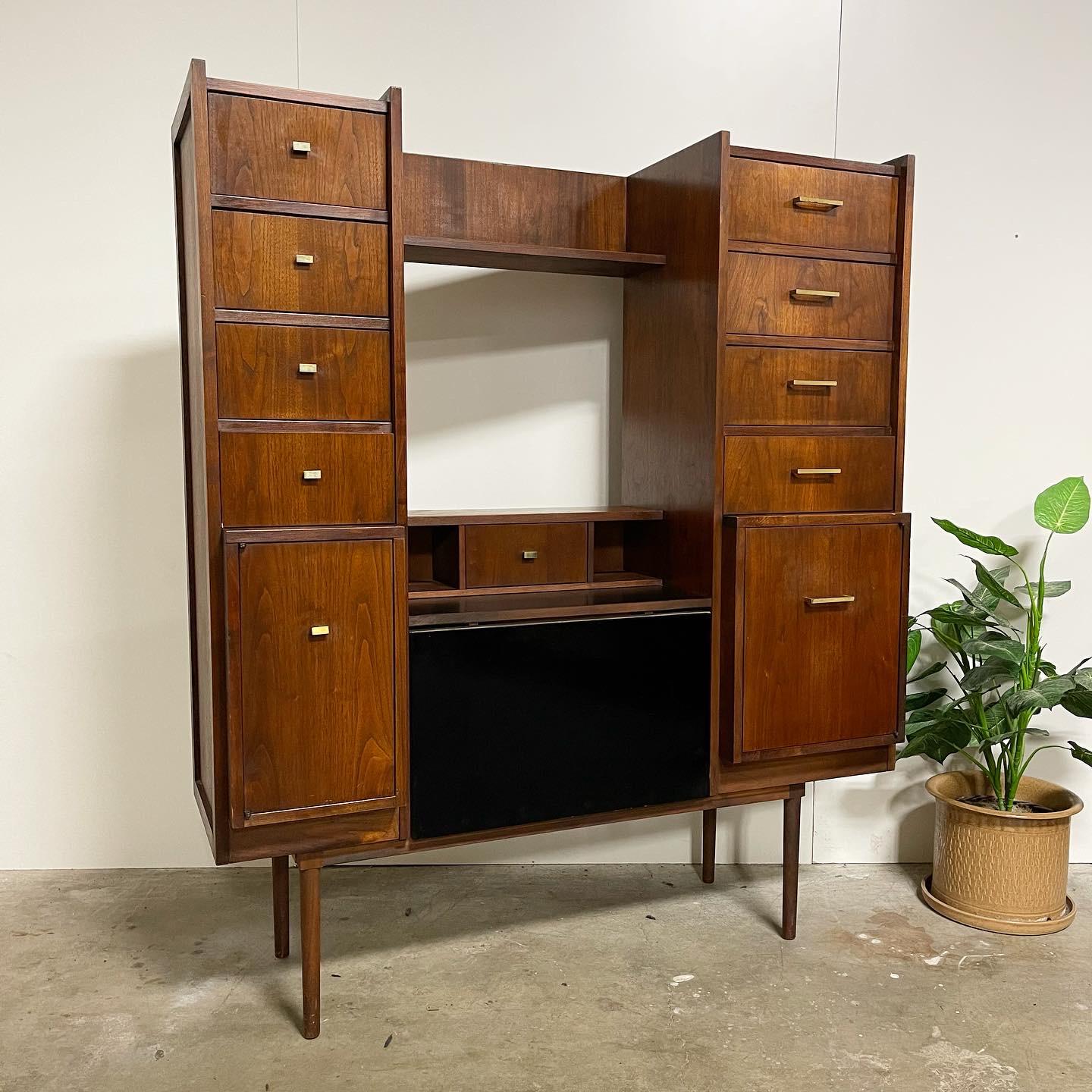 Mid century secretary desk by Richardson Bros Co. never have I seen one of these beauties. Gorgeous walnut build with all original brass hardware aged to perfection. Sitting on sturdy tapered 15” legs that make this piece command attention in your