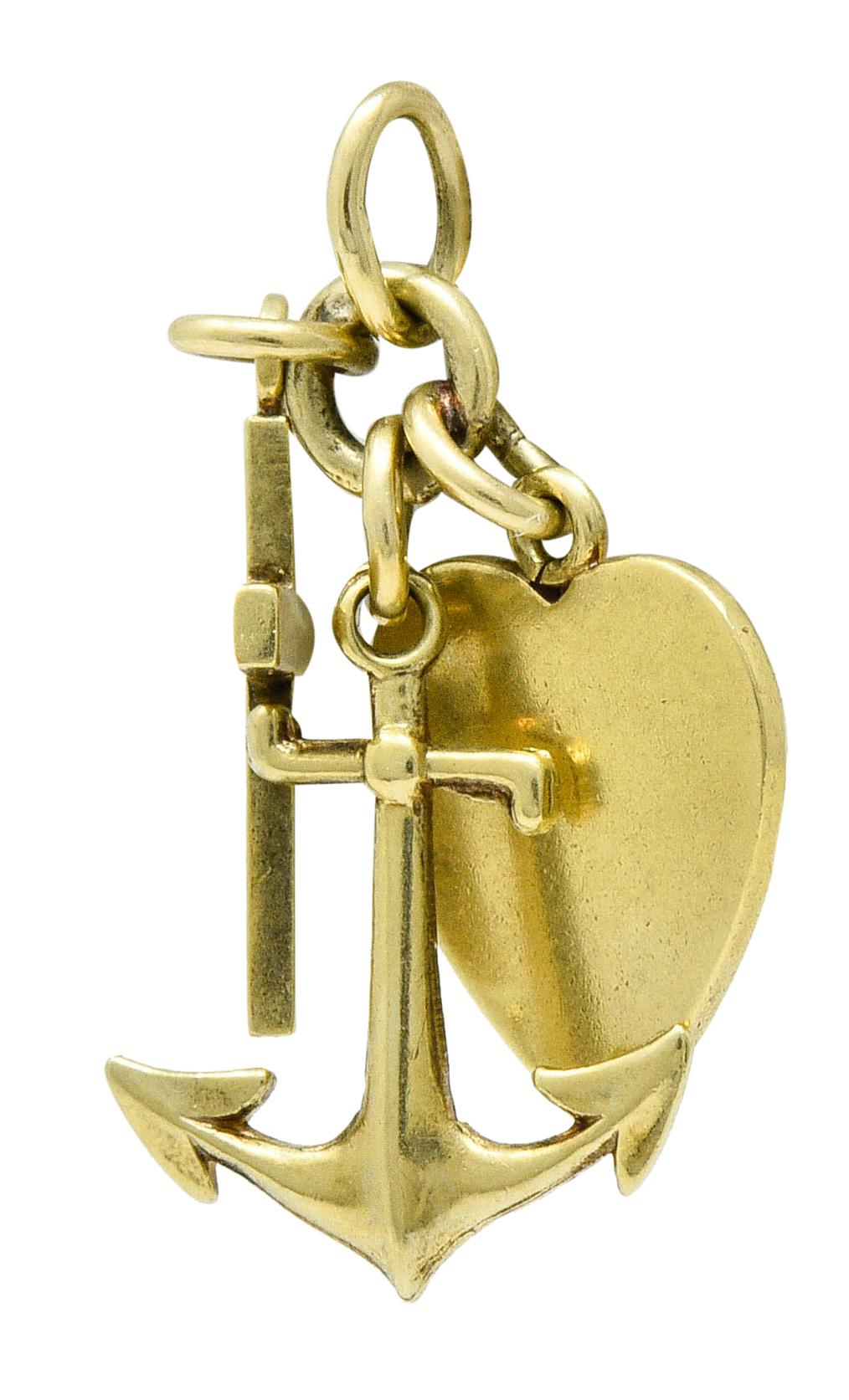 Designed as a cluster of three charms

Suspending a cross, an anchor, and a heart

Symbolic of faith, hope, and love - respectively

Stamped 14K for 14 karat gold

Maker's mark for Richardson Manufacturing Co.

Circa: 1940s

Measures approx.: 1/2 x