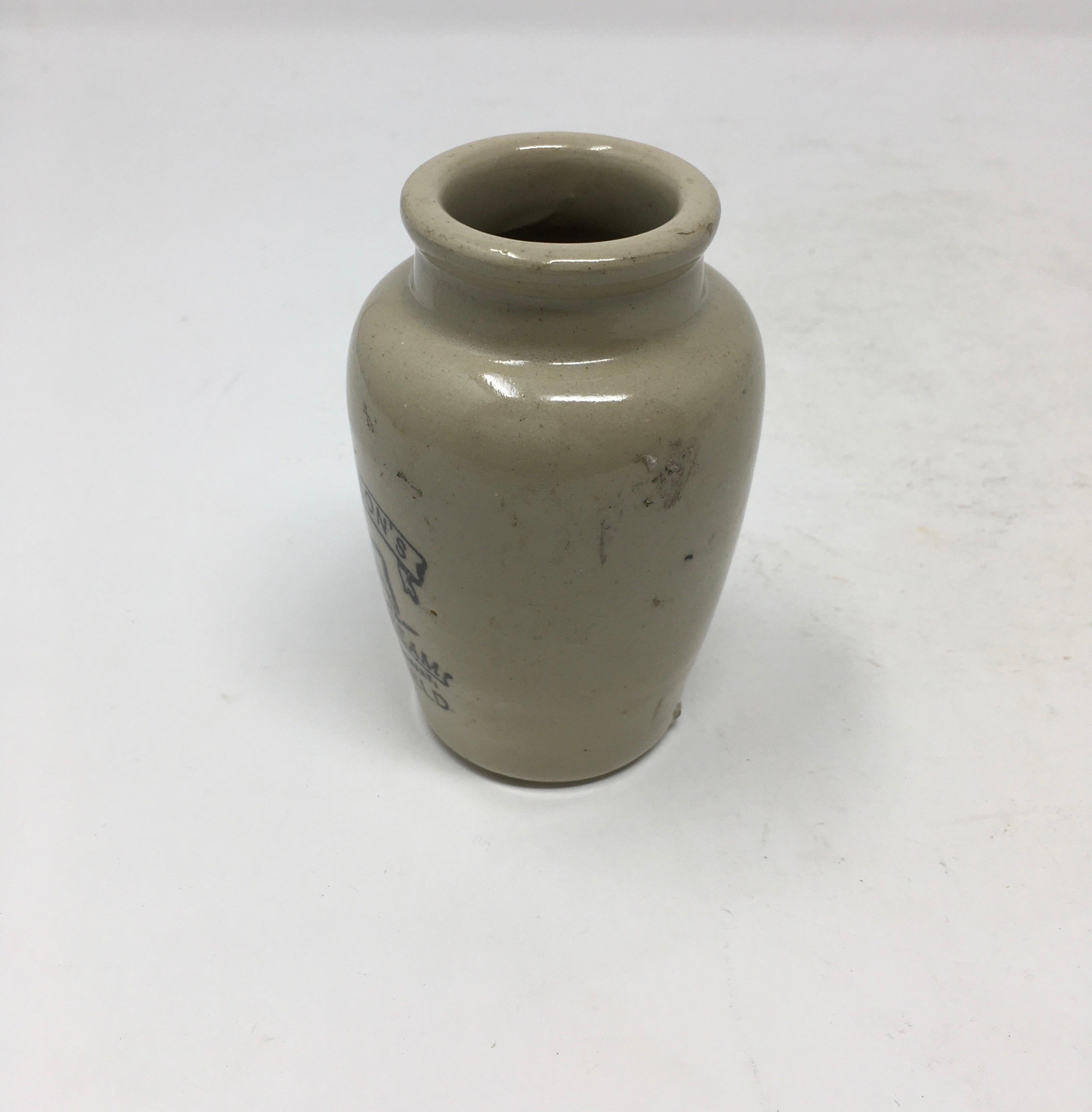 Found in England, this vintage Richardson's thick-cream ironstone advertising jar from Sheffield is in good clean condition. The decorative pot that once held cream has transfer on the front in black lettering under the glaze and a picture of a cow