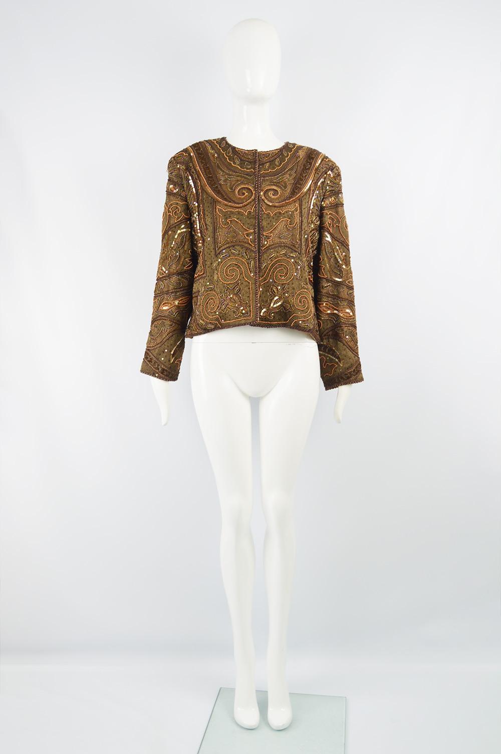 Richilene Vintage Intricately Beaded & Embroidered Shoulder Padded Trophy Jacket

Size: Not indicated; fits like a UK 16-18/ US 12-14/ EU 44-46. Please check measurements.
Bust - 44” / 112cm (allow a couple inches room for movement)
Waist - 42” /