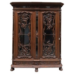 Antique Richly carved 19th century cabinet with claw feet.