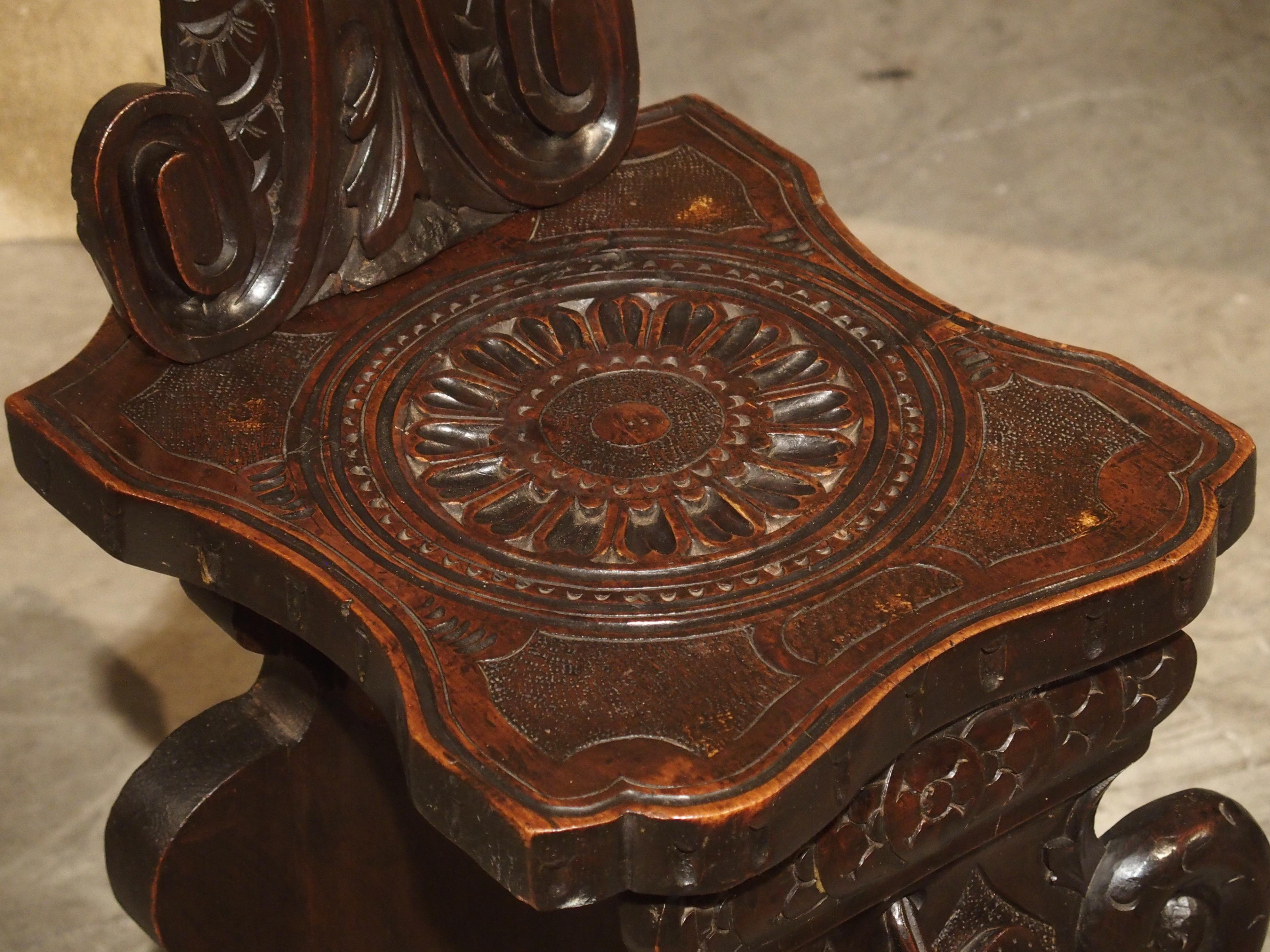Richly Carved 19th Century Escabelle Chair from Switzerland In Good Condition In Dallas, TX