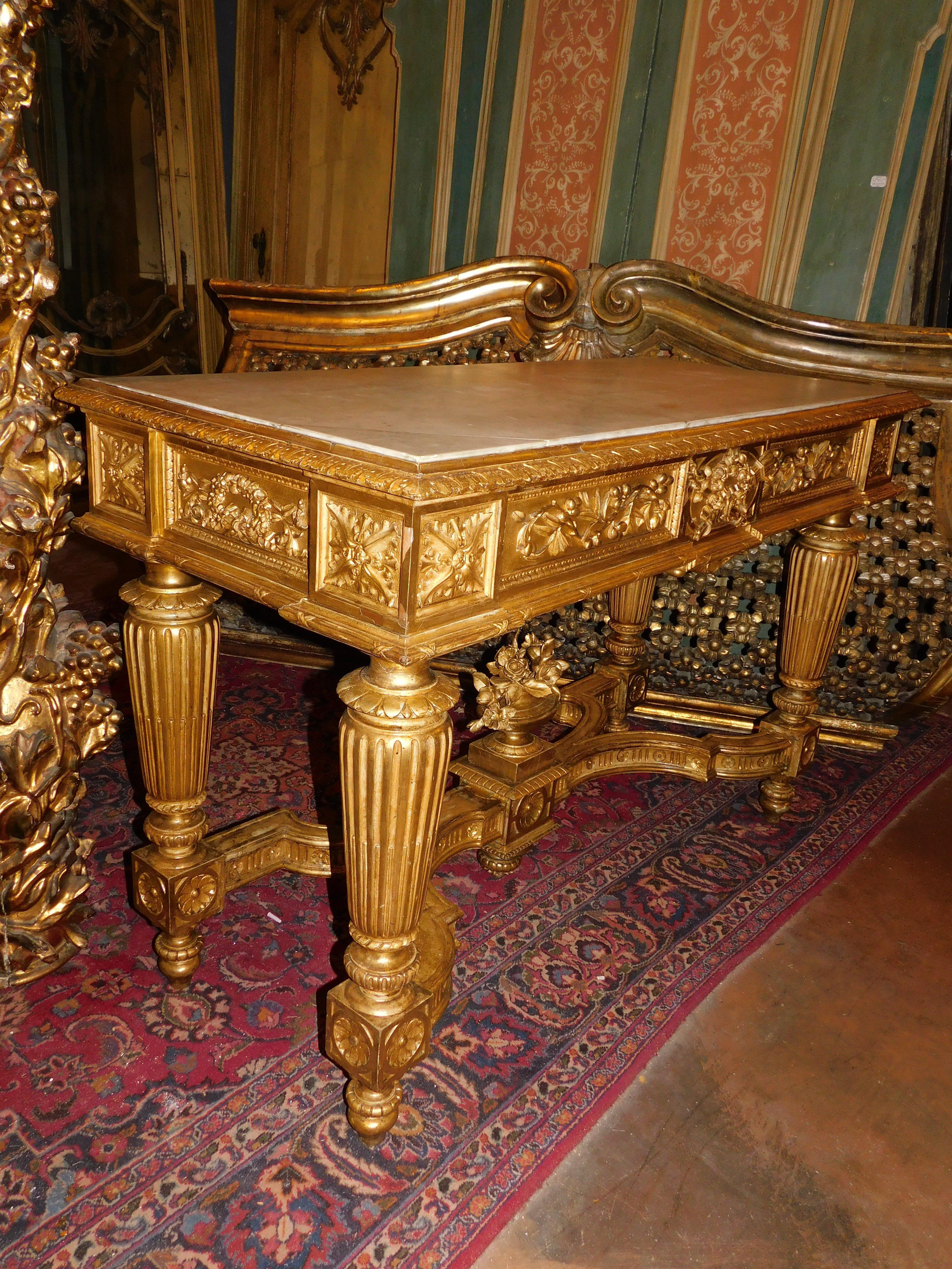 Richly carved and gilded wooden console table, white marble top, Italy For Sale 5