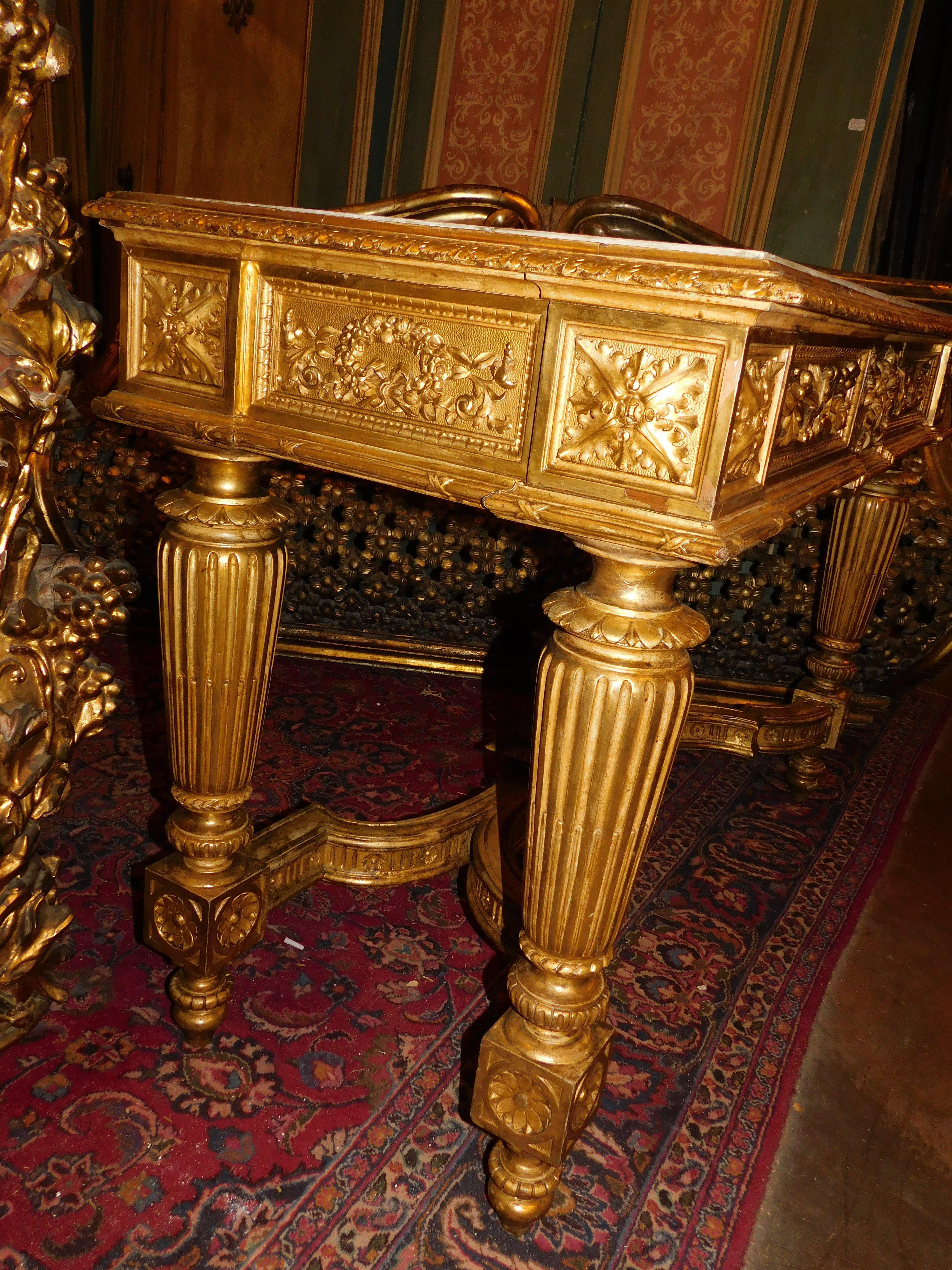 Richly carved and gilded wooden console table, white marble top, Italy For Sale 6