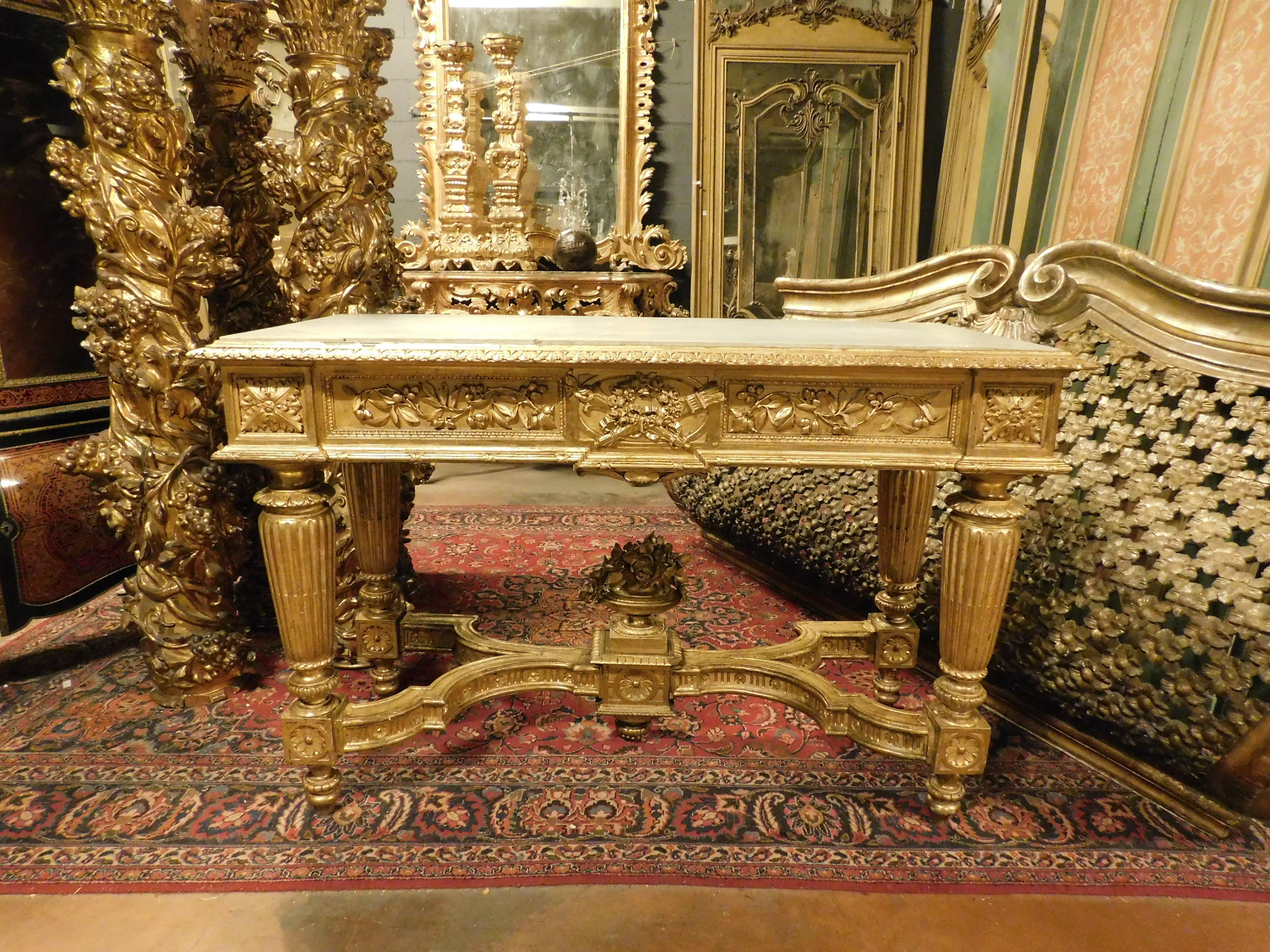 Italian Richly carved and gilded wooden console table, white marble top, Italy For Sale