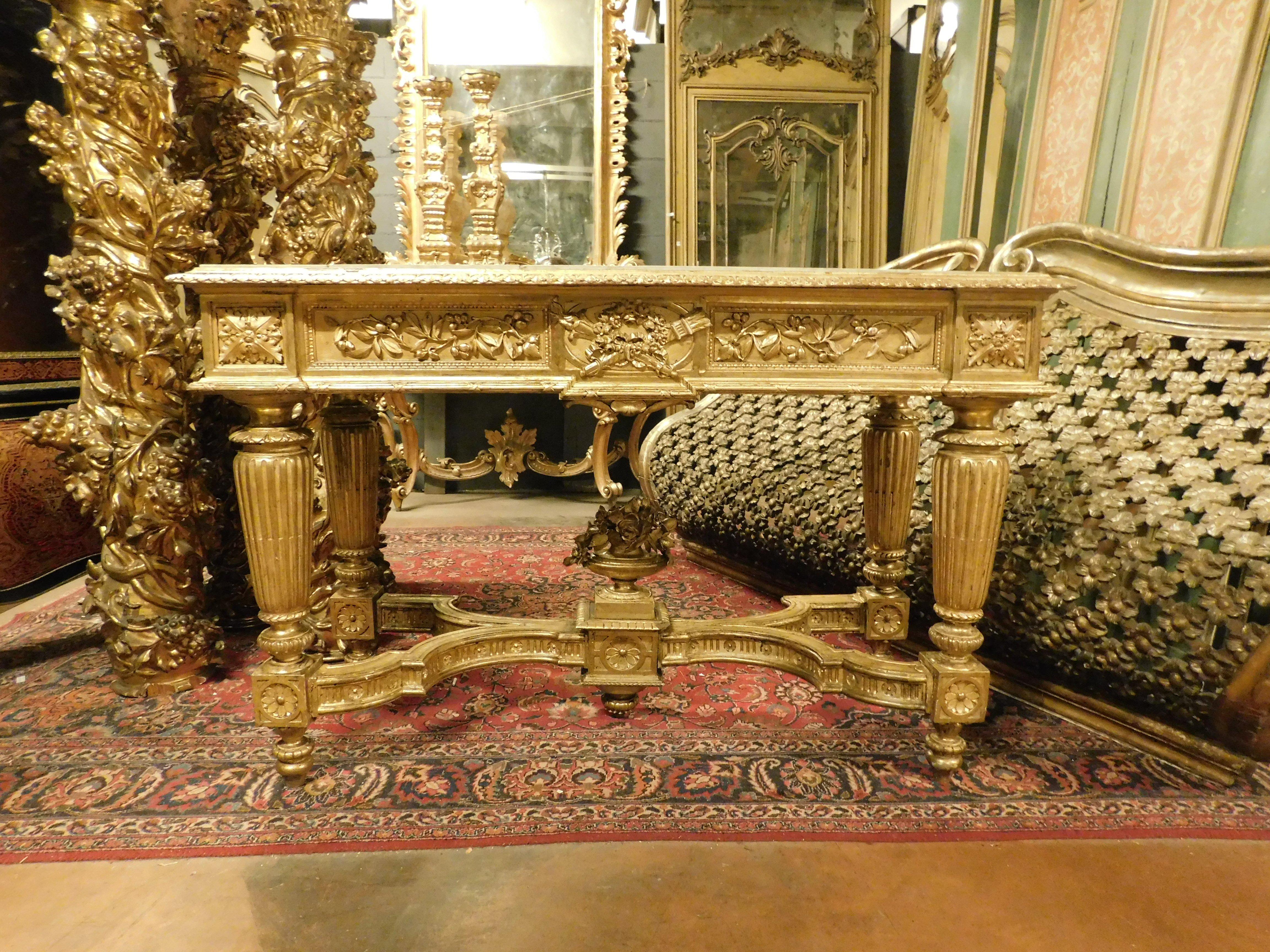 Carved Richly carved and gilded wooden console table, white marble top, Italy For Sale