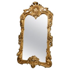 Specchio in legno dorato riccamente intagliato, Italia