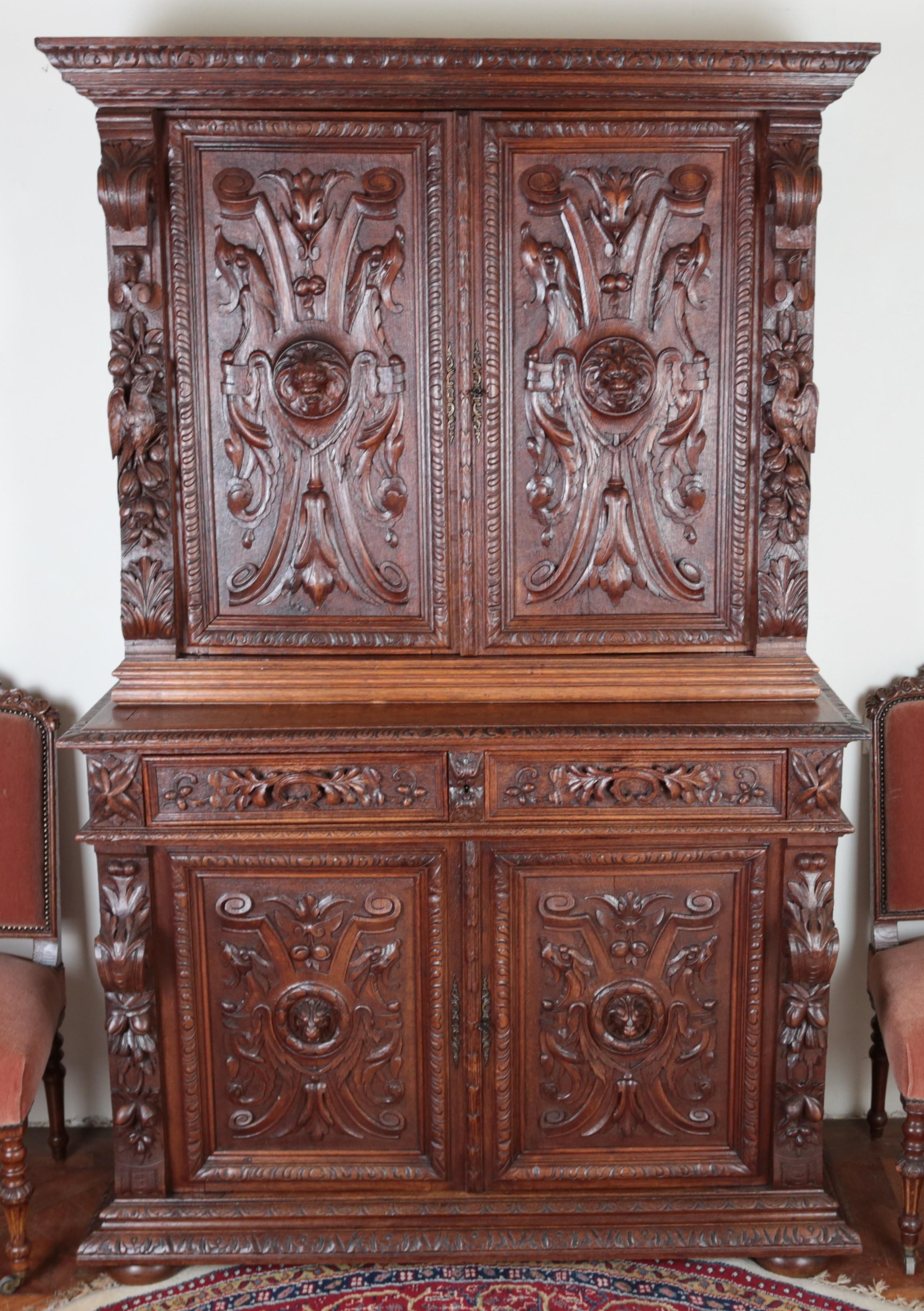 Richly carved Neo-Renaissance solid oak cabinet

Precise carving work from the 19th century in the Renaissance style. Two-part design where the upper two-door part has internal shelves and the lower part with two drawers in the upper part on the