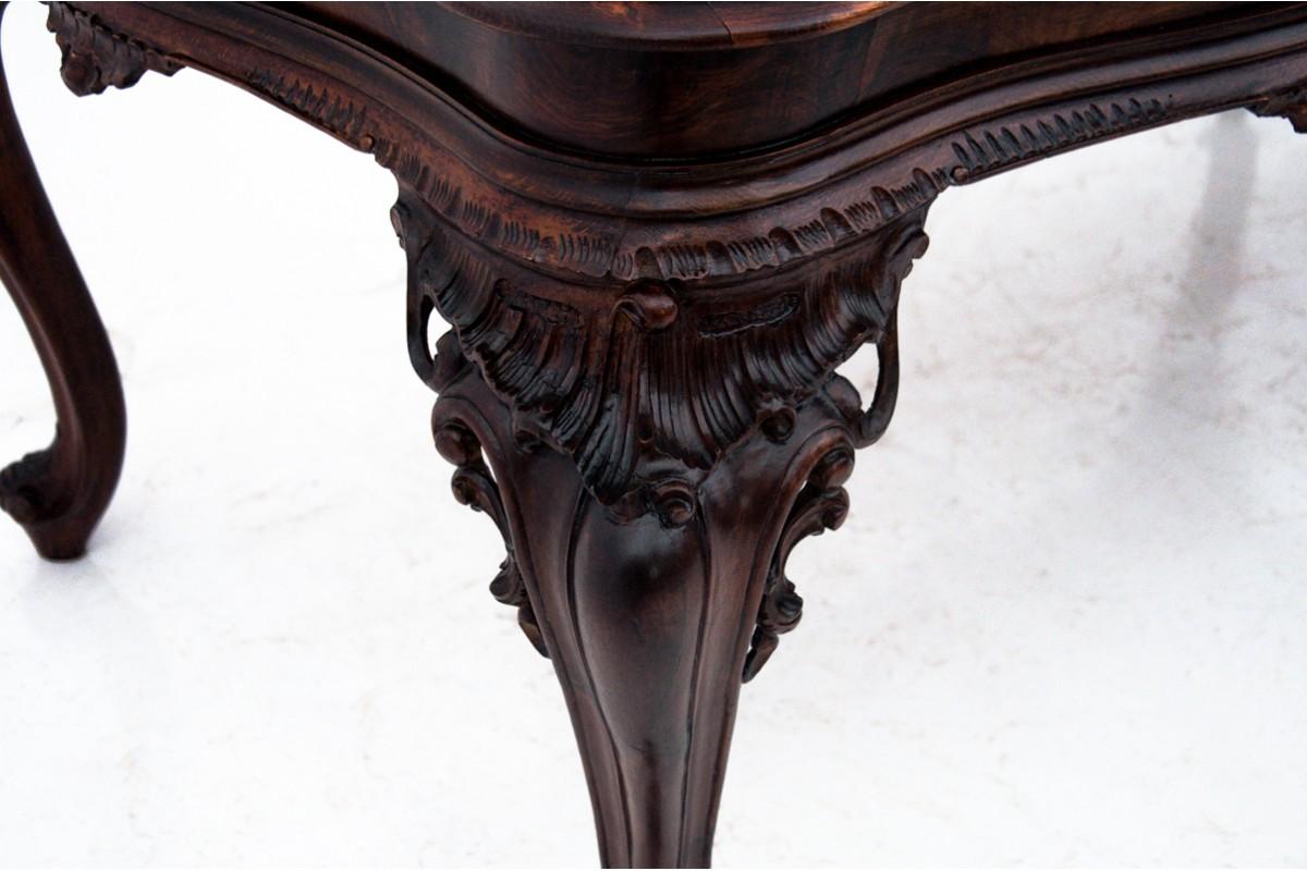 Walnut Richly carved table, Southern Europe, first half of the 20th century. After reno
