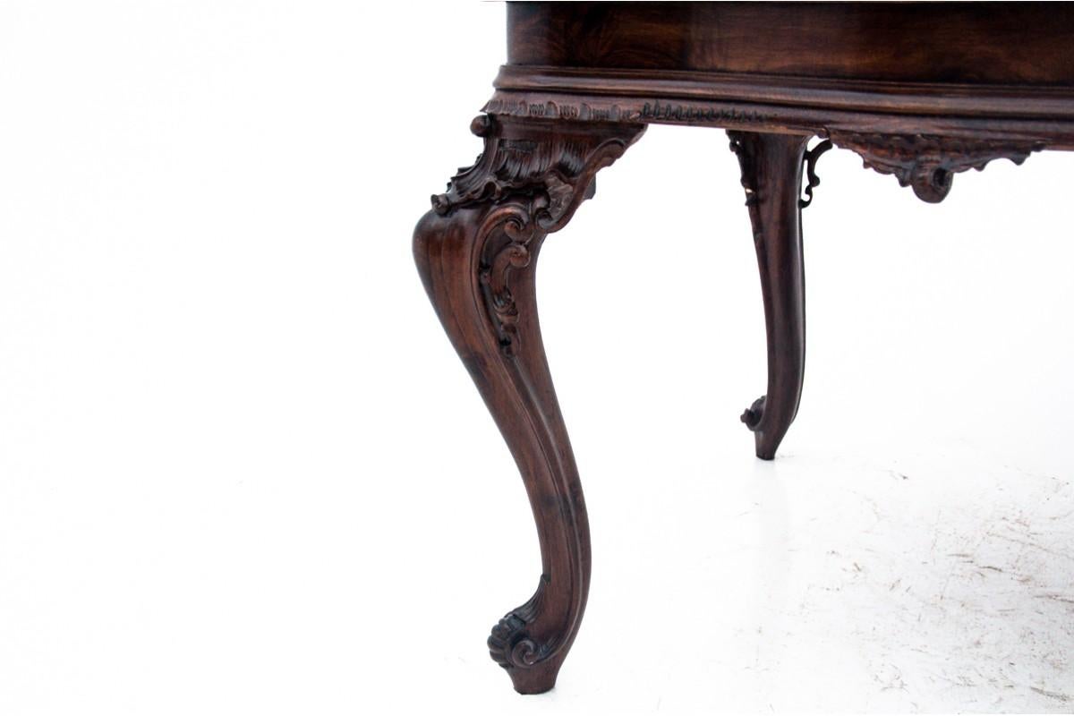 Richly carved table, Southern Europe, first half of the 20th century. After reno 1