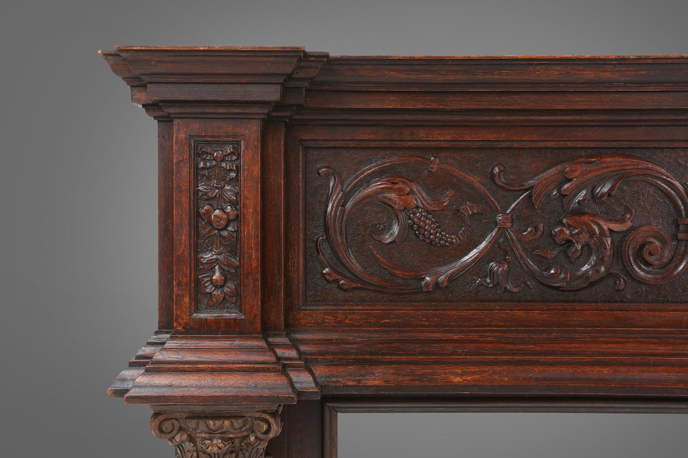 Belgian Richly decorated antique fireplace in oak, Belgium ca. 1920 For Sale