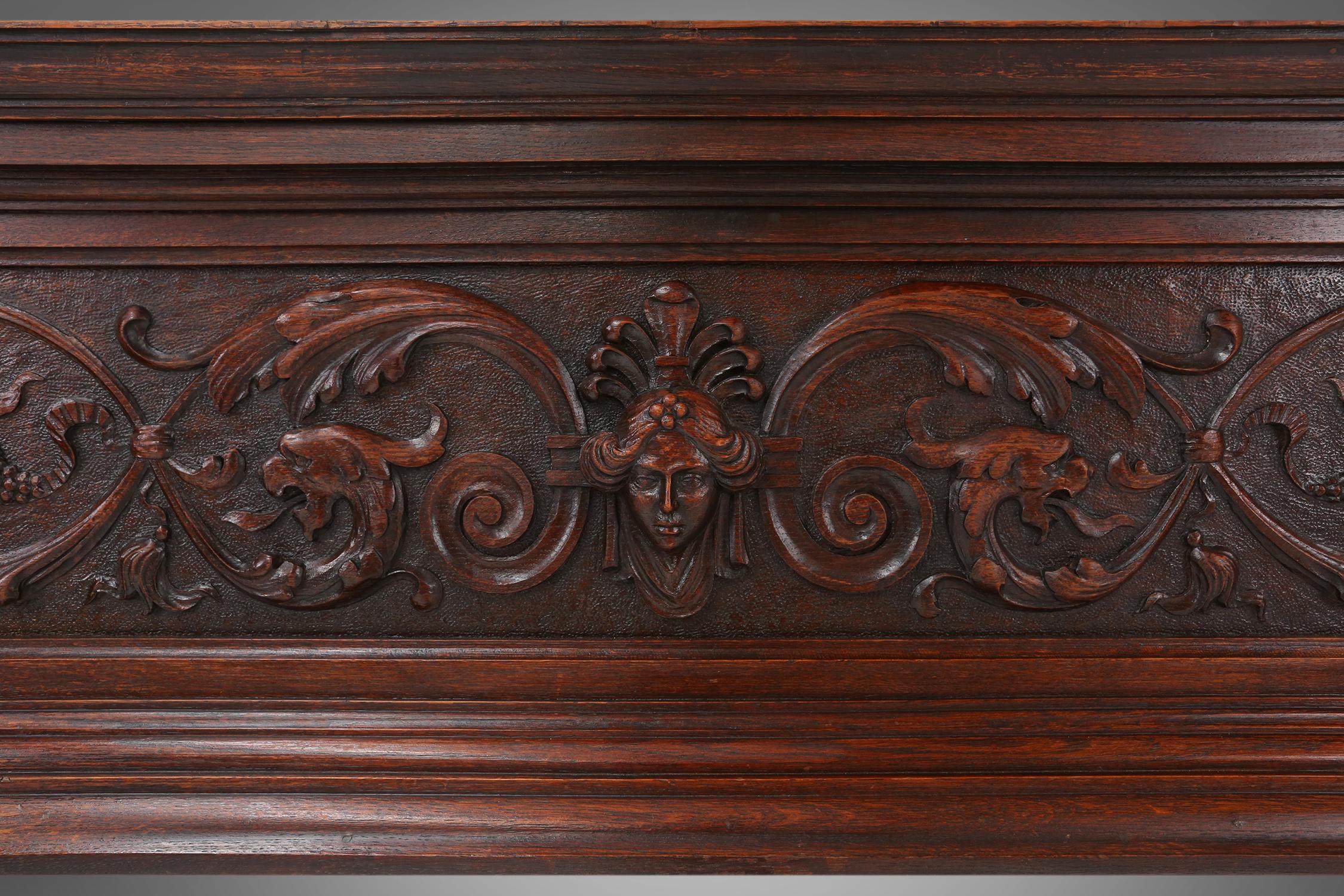 Hand-Carved Richly decorated antique fireplace in oak, Belgium ca. 1920 For Sale