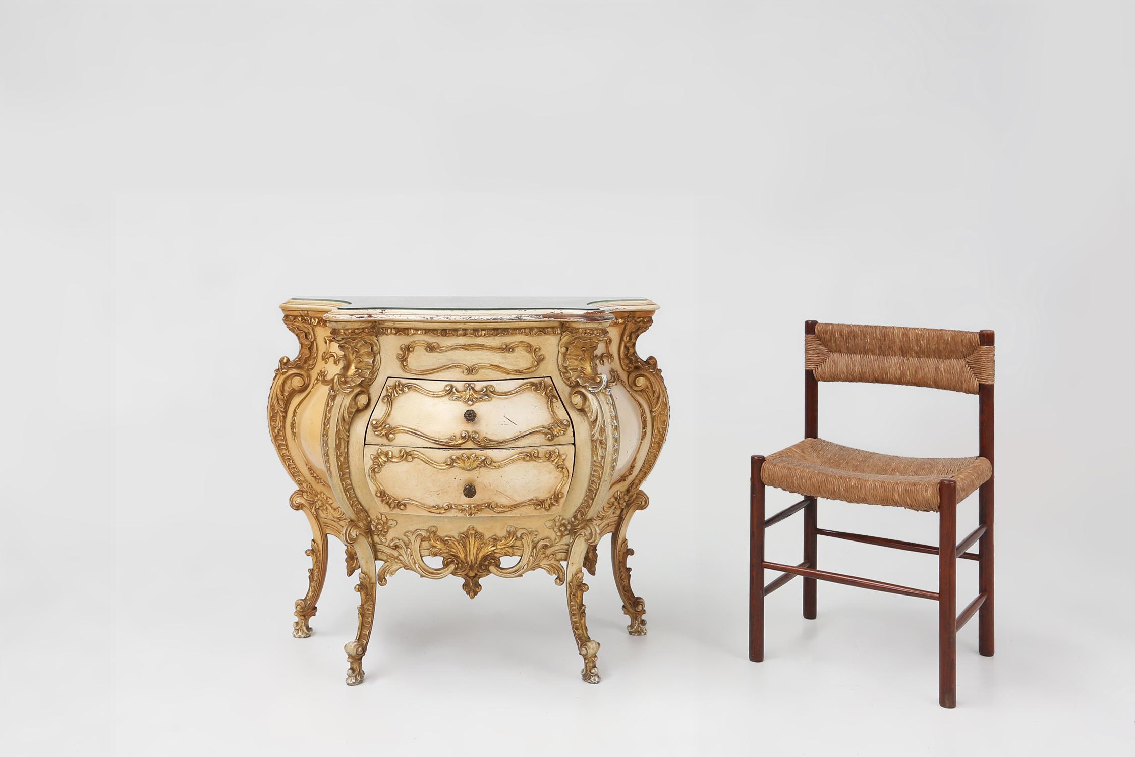 France / 1950 / commode / resin, wood, marble / barok style / rococo style

And unusual creme and gold decorated commode in Rococo style, made in France around 1950. This chest has unusually pronounced curves and a nicely worn faux with a gold wash
