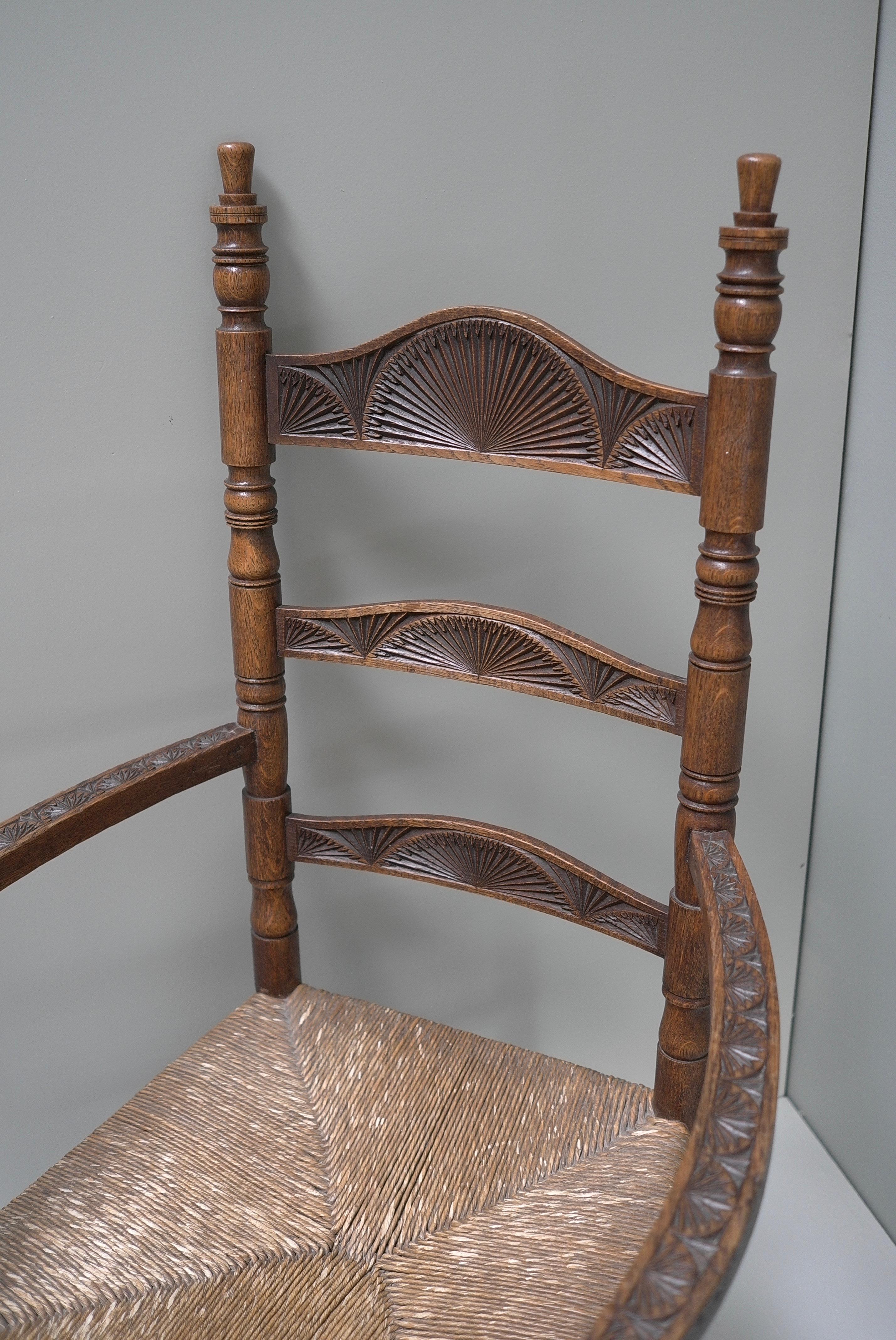 Richly decorated 'Old Dutch' Oak Hand-Carved Knob chair, based on the seventeenth-century shape, ca. 1910-1940.

The Knob Chair with a rush seat is an Dutch archetype. This chair appeared in many Dutch households from the 17th century and well into