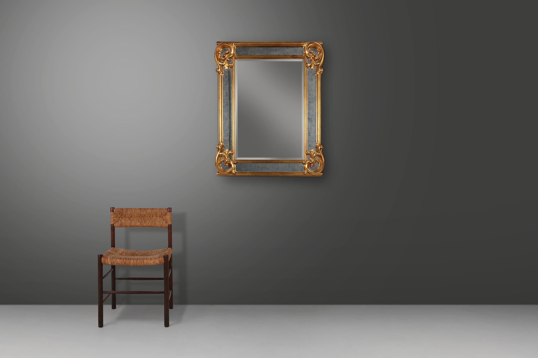 Belgium / 1950 / mirror / resin, mirror and smoked glass mirror glass / mid-century / vintage

Baroque style large wall mirror with extra wide frame, made in Belgium in the 1950s. This stunning piece can be hung in a portrait and landschap
