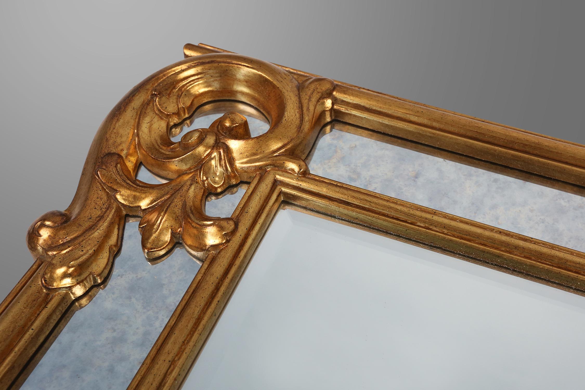 Belgian Richly decorated wall mirror in resin with golden ornaments and smoked mirror gl For Sale