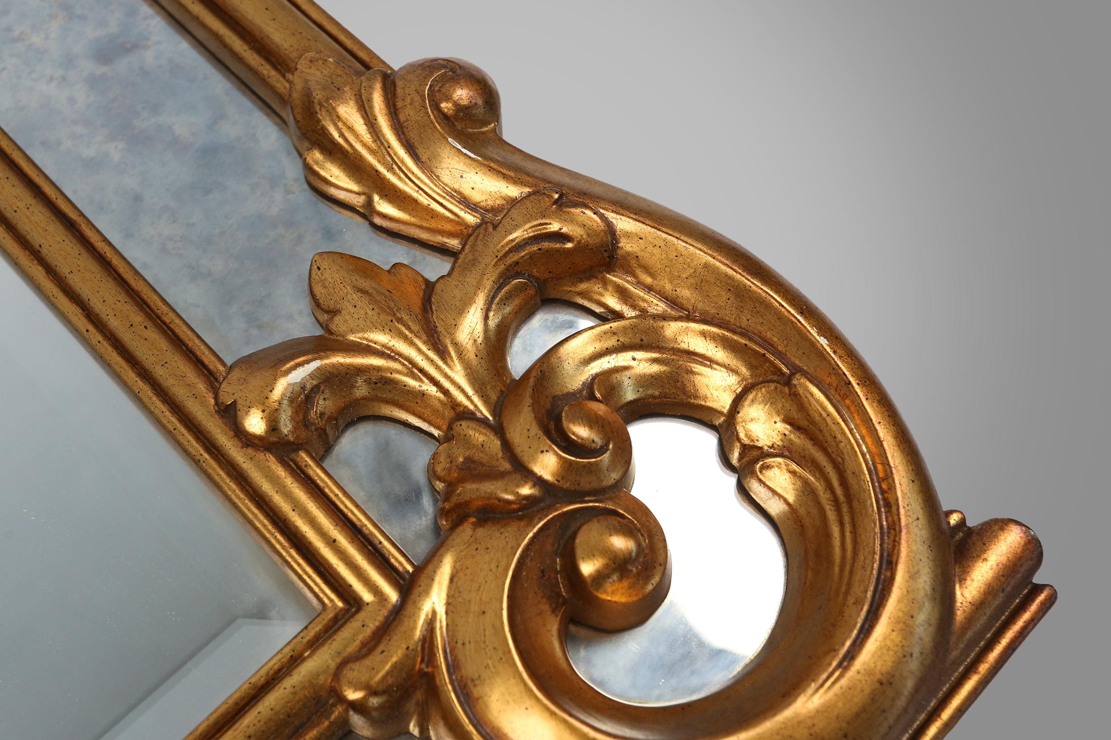 Richly decorated wall mirror in resin with golden ornaments and smoked mirror gl For Sale 2