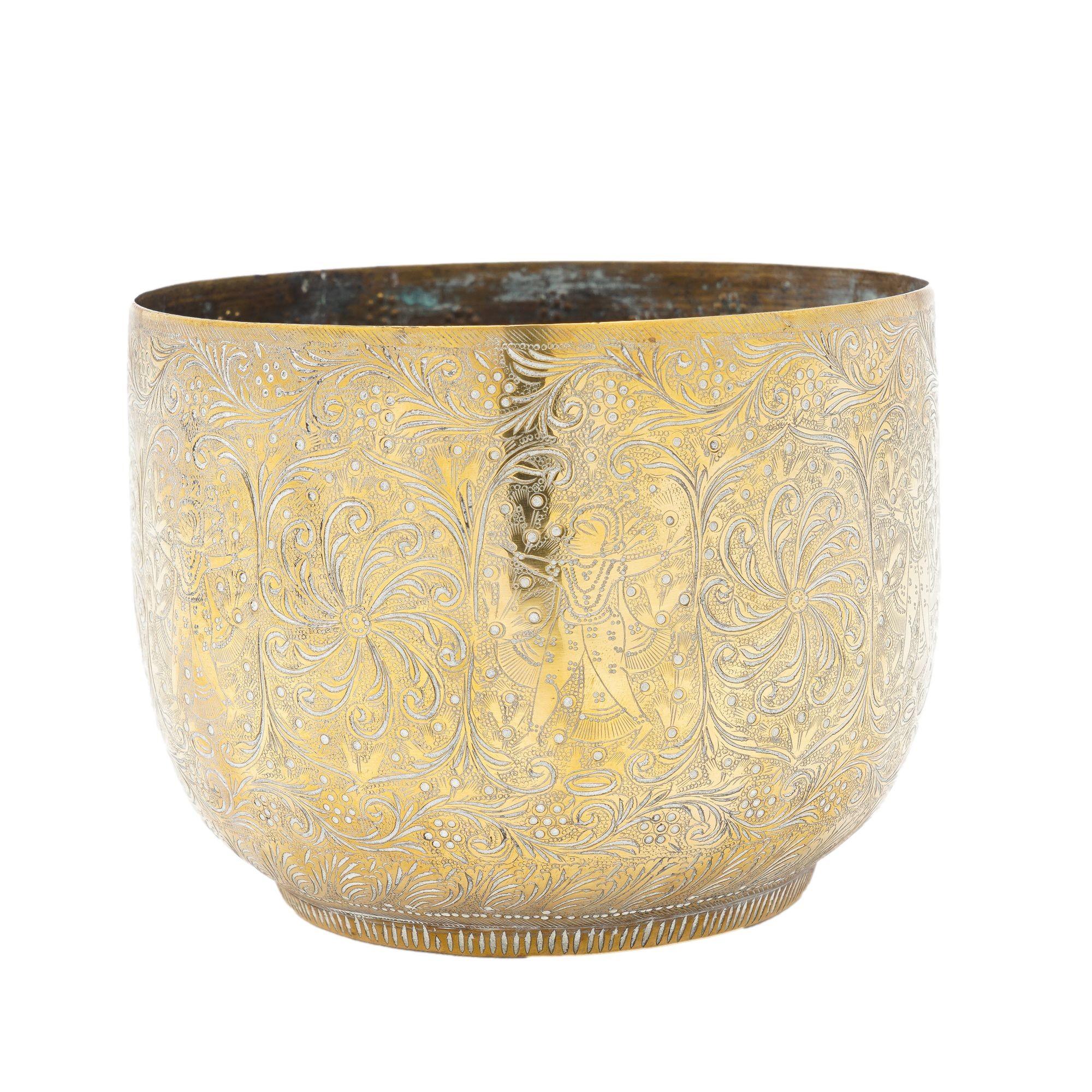 Richly hand engraved brass cache pot with footed base and an engraved figure on under foot.
Persian, circa 1880-1900.