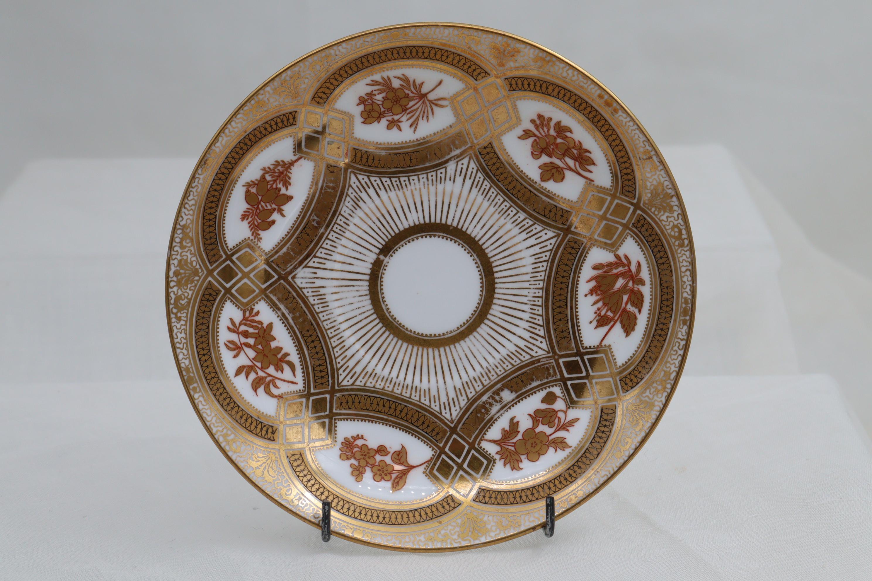 This good quality demitasse by Brown-Westhead & Moore of Hanley in Staffordshire, is decorated with an inticate, richly gilt pattern featuring cartouches containing stylised flowers. The pattern number is C 3785. It is in very good condition, but