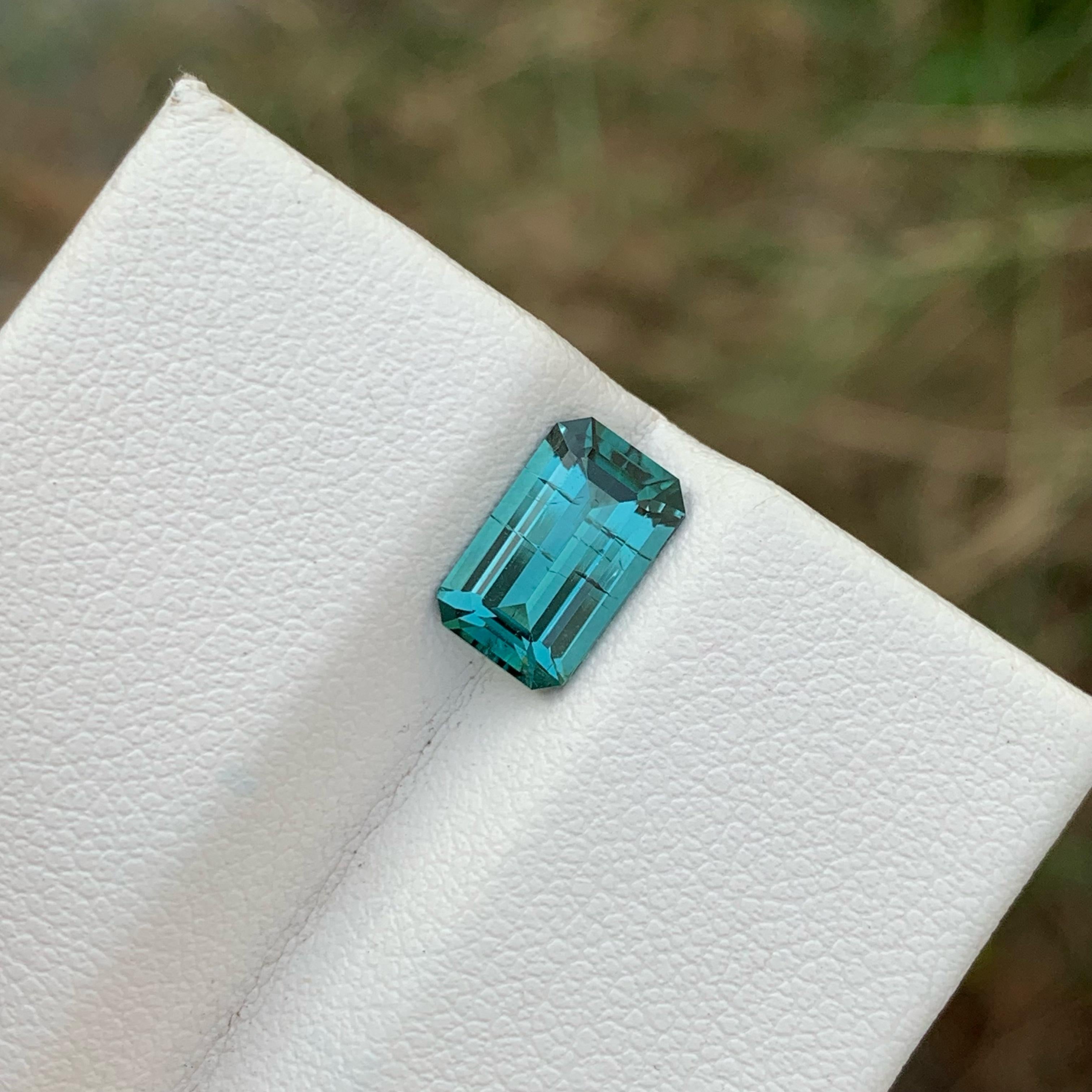 Weight 1.80 carats 
Dimensions 9.5 x 5.8 x 4.1 mm
Treatment None 
Origin Afghanistan 
Clarity SI (Slightly Included)
Shape Octagon 
Cut Emerald 


Discover the captivating allure of a genuine 1.80 carat emerald cut Blue Tourmaline gemstone from