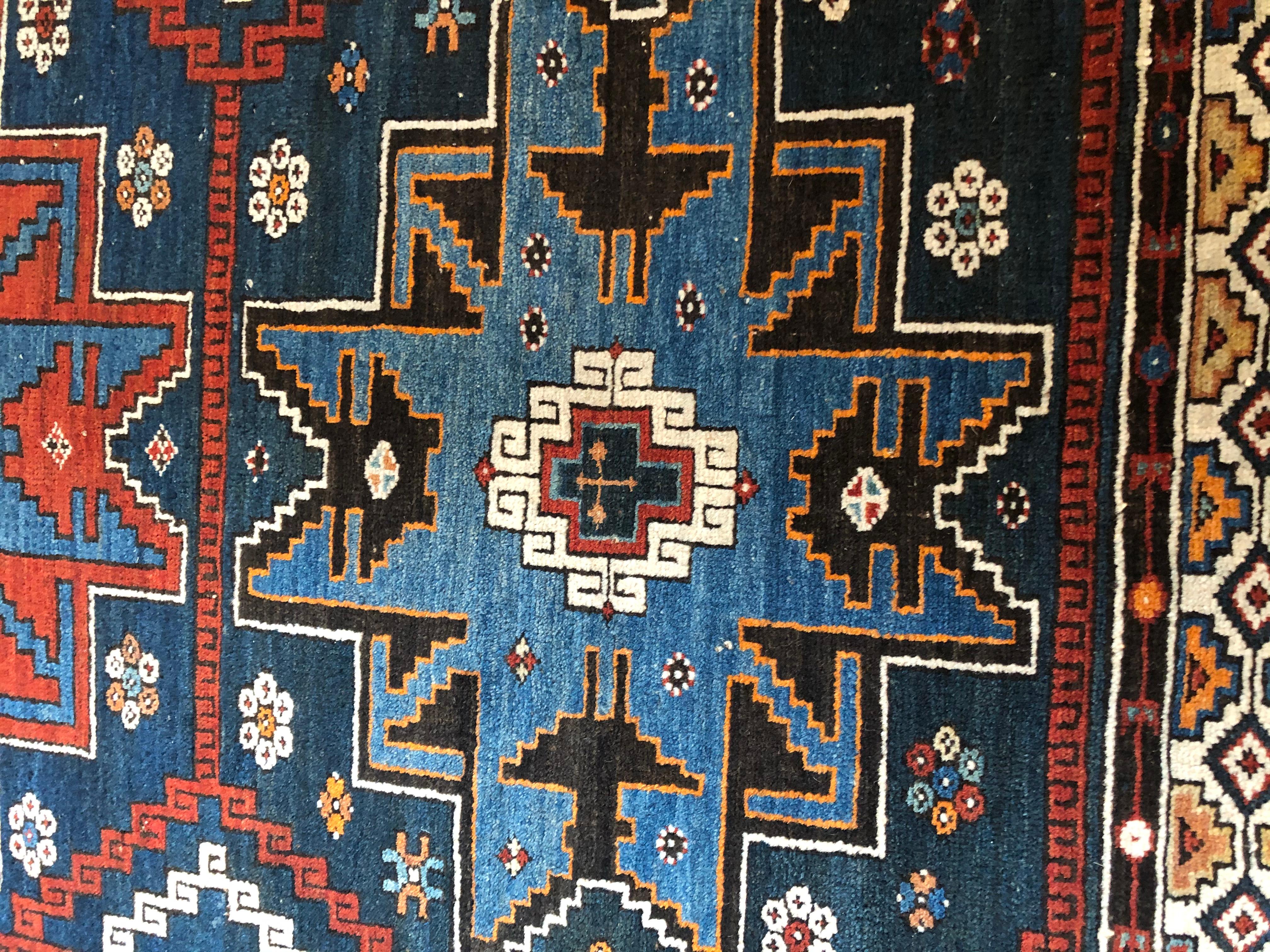 Richly Patterned Antique Area Rug in Blues and Cranberry In Good Condition In Hopewell, NJ