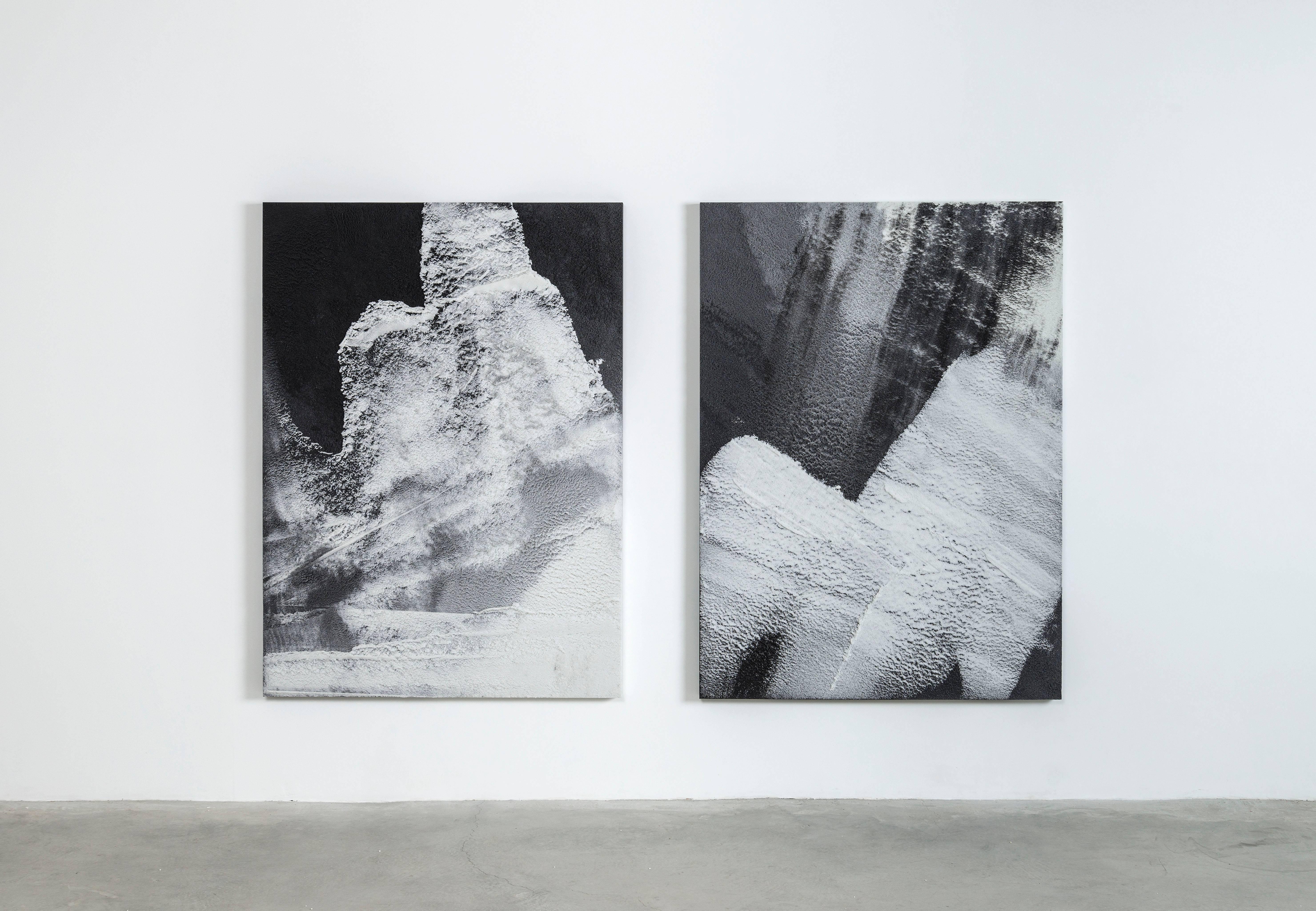 Composed in a language of landscape-oriented abstraction, the painting is made entirely from powdered glass. With hand-dyed granules in black and white tones, the materials create an effect evocative of aerial views of a rugged terrain.