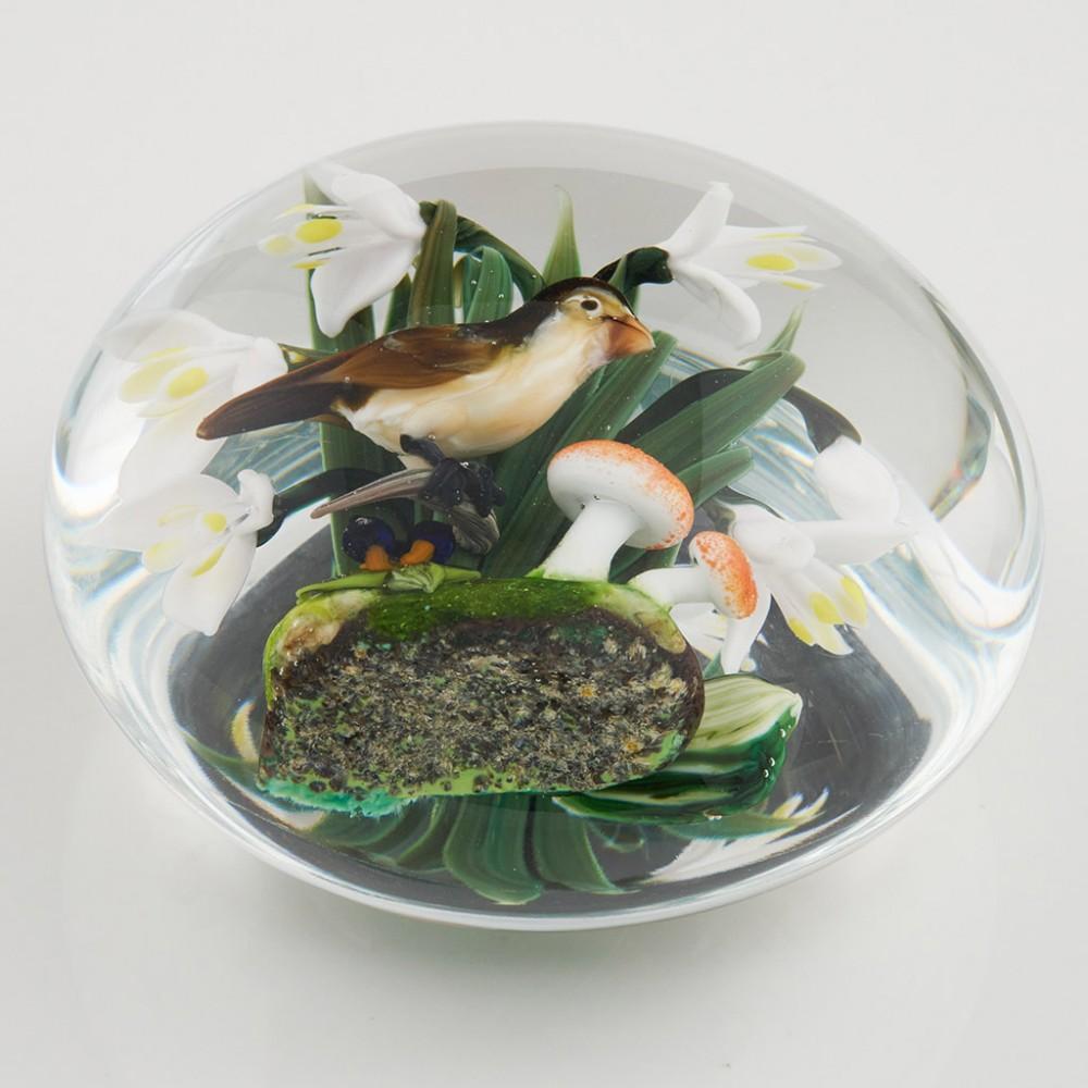 Heading : A Rick Ayotte paperweight depicting a snow bunting
Date : 1990
Origin : New Hampshire, USA
Features : Depicts a snow buting in front of snowdrops and mushrooms.
Marks :Signed Rick Ayotte ED/50  '90
Size : 9.3cm diameter, 5.4cm