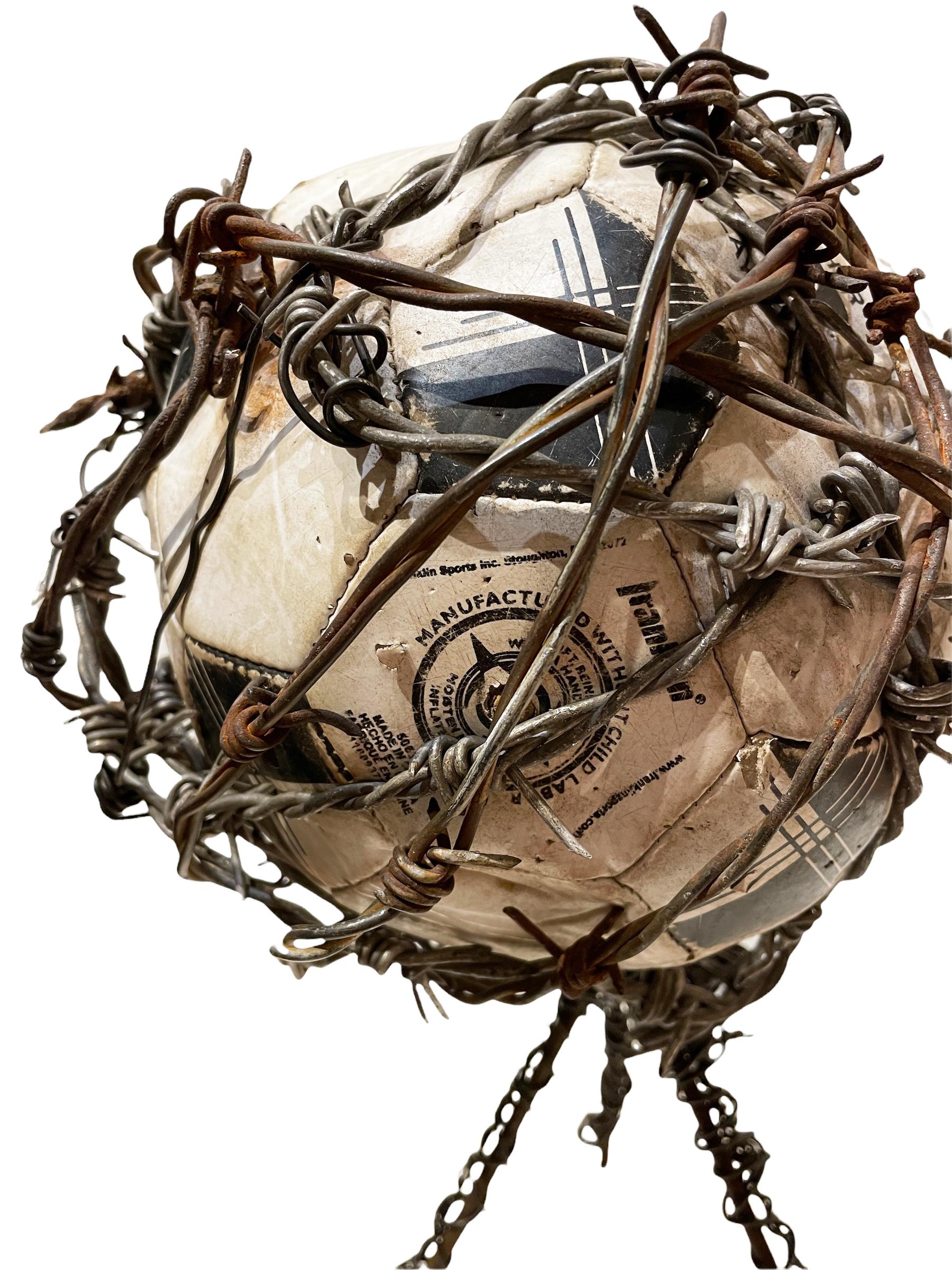 FIFA  - Found Object Sculpture with Deflated Soccer Ball and Barbed Wire - Contemporary Mixed Media Art by Rick Farrell
