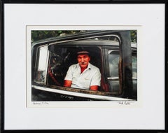Havana, Cuba Daily Life Color Photograph of a Man Sitting in a Black Car