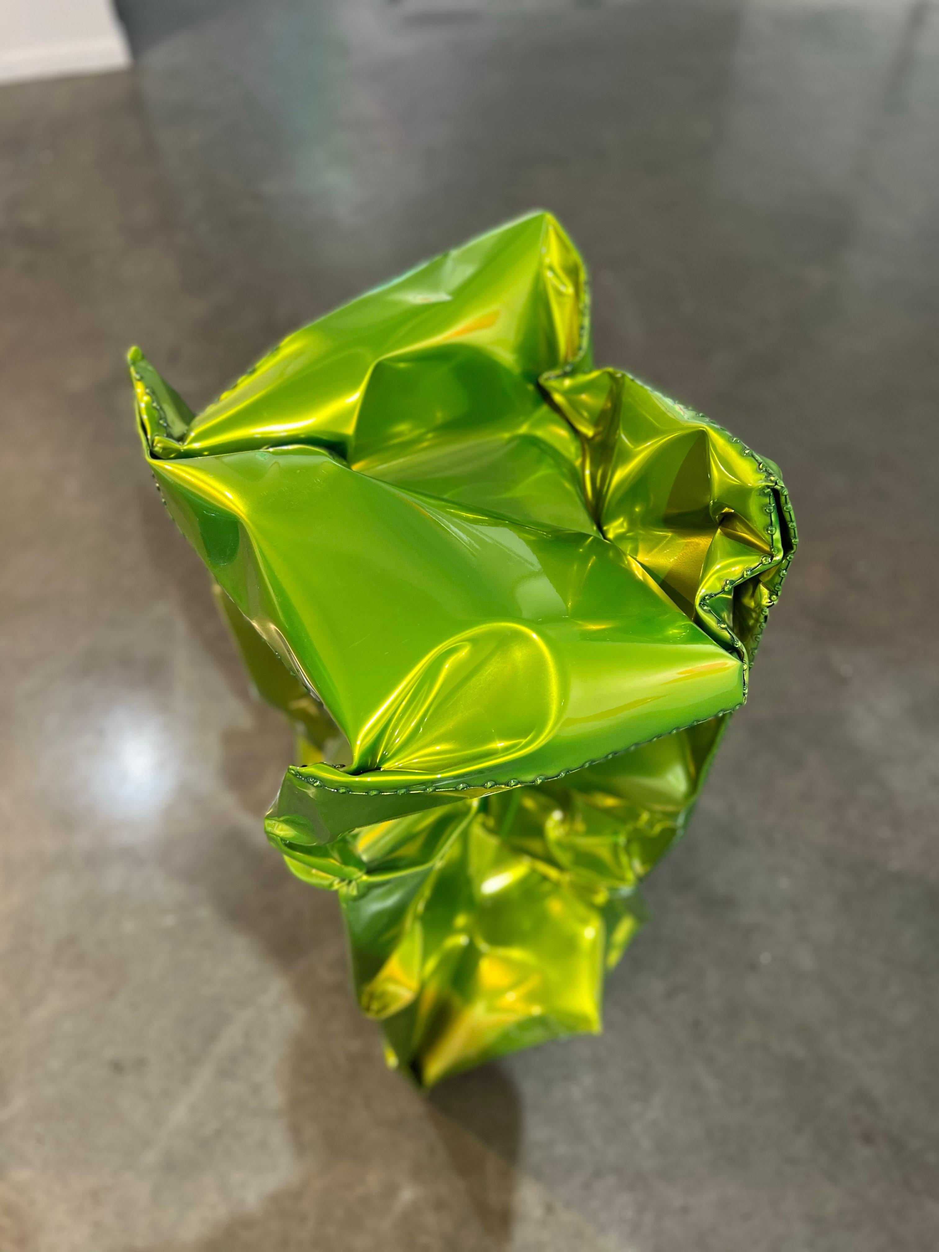 An outdoor sculpture made out of powder coated stainless steel. This sculpture is a rich, vibrant, and shiny lime green. 

Rick Lazes is a three dimensional artist who works in a variety of media including wood, plaster, stainless steel, glass,