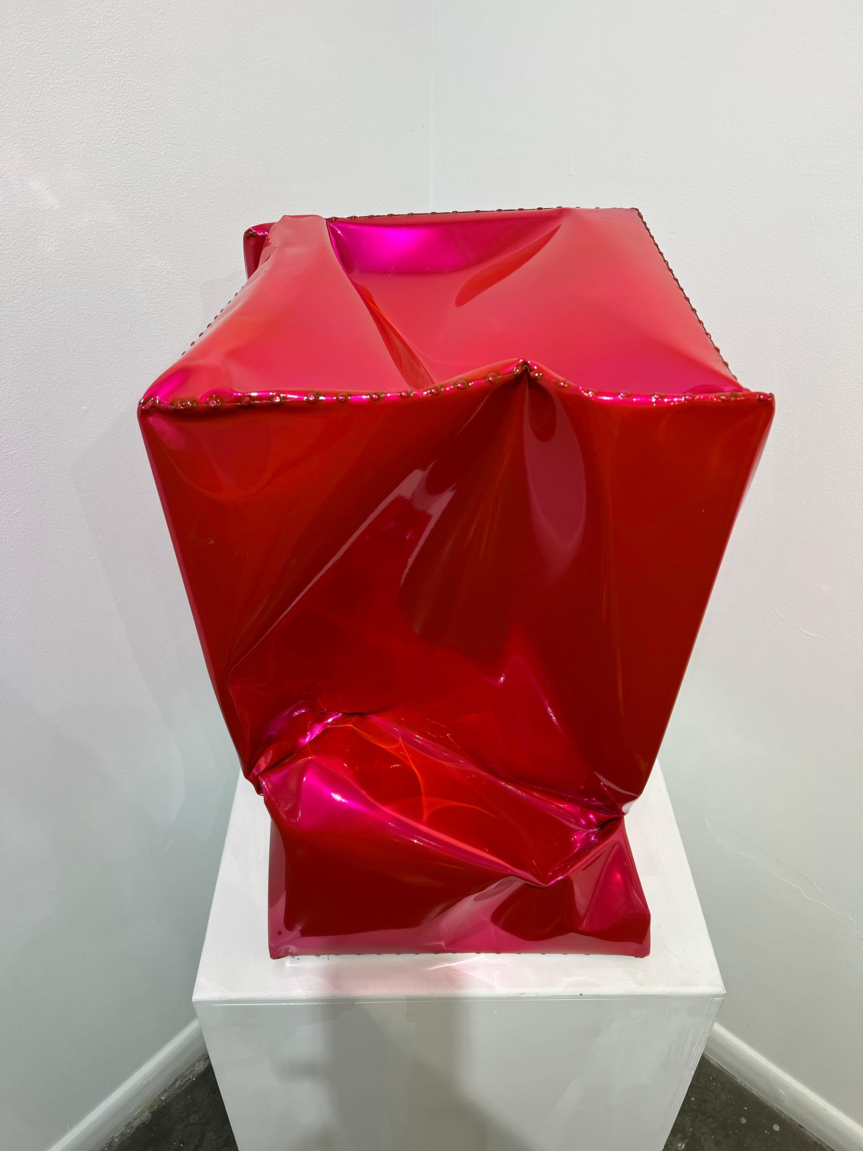 An outdoor sculpture made out of powder coated stainless steel. This sculpture is a rich, vibrant, and shiny pink. 

Rick Lazes is a three dimensional artist who works in a variety of media including wood, plaster, stainless steel, glass,