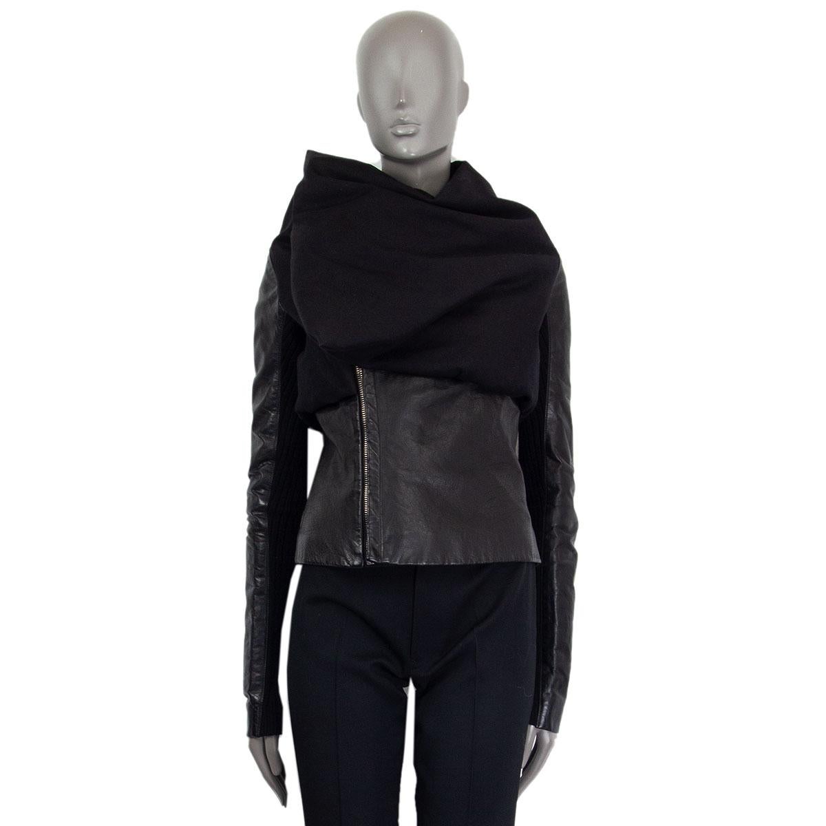 Rick Owens padded pouch front jacket in black calf leather (50%), cotton (40%), alpaca (5%) and nylon (5%). Has inner knit detailed sleeves. Closes on the front with a zipper. Lined in rayon (60%), cotton (35%) and silk (5%). Padding is polyester