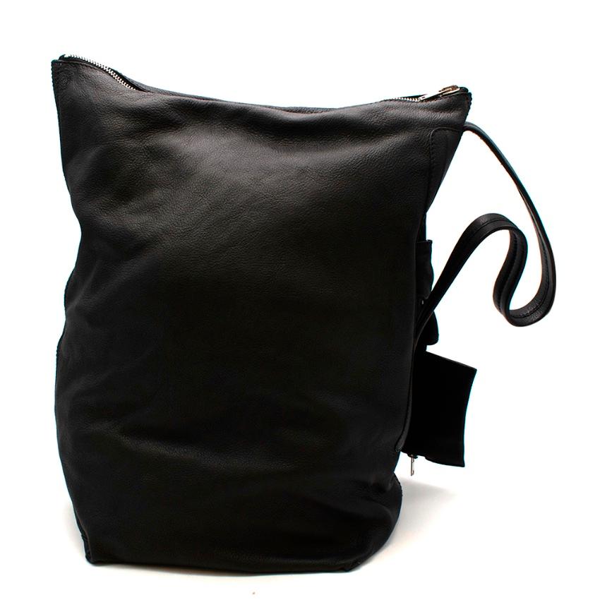 Rick Owens Black Leather Shoulder Bag

- Made of soft deer leather 
- Neutral black hue 
- Shoulder strap to the side 
- Zip fastening to the top 
- Small coin purse 
- 3 inner pockets
- Interesting modern design 

Materials:
leather 

Made in Italy