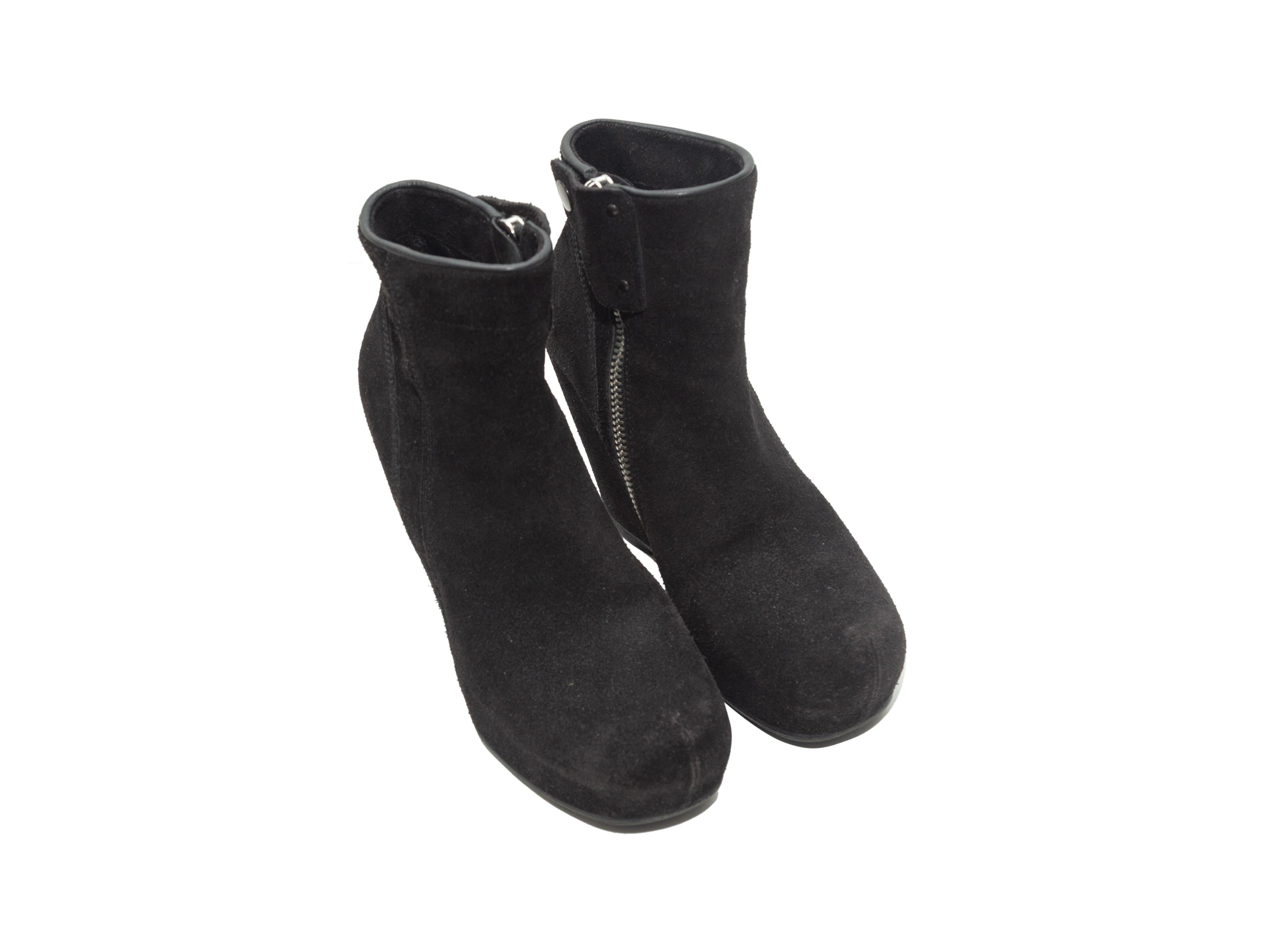 Product details: Black suede round-toe ankle boots by Rick Owens. Wedge heels. Zip closures at inner sides. 4