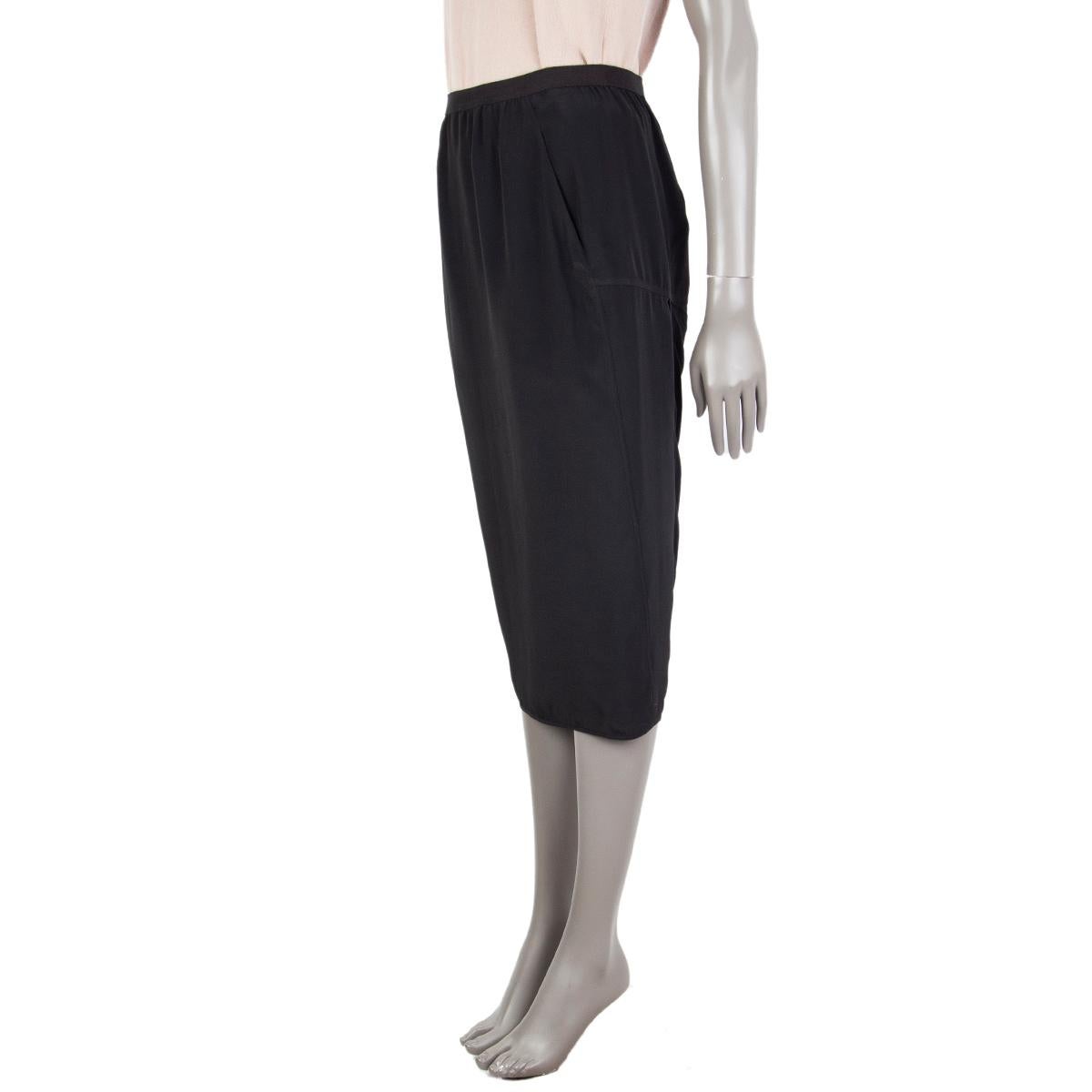 100% authentic Rick Owens 'Walrus' pencil skirt in black viscose 84% and acetate (16%) - please note content tag has been removed. With wrap slir on the back, and two slit pockets on the sides. Unlined. Has been worn and is in excellent