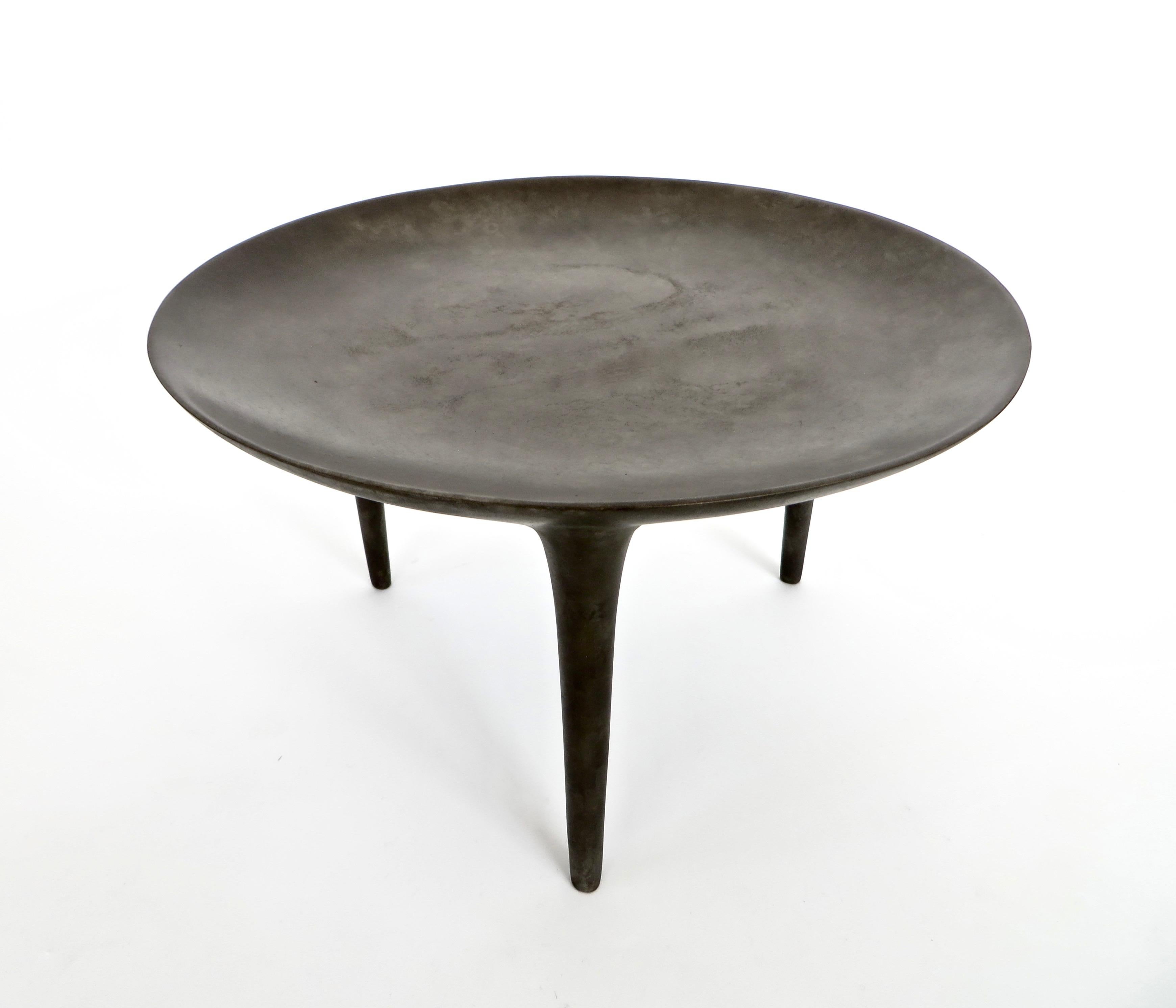 Handmade low three-legged cast bronze brazier or side table from the Rick Owens home collection. 'Low Brazier' three-legged table in solid bronze with nitrate finish. Shown is the nitrate finish. 
Signed Rick Owens. 
Also available in black finish