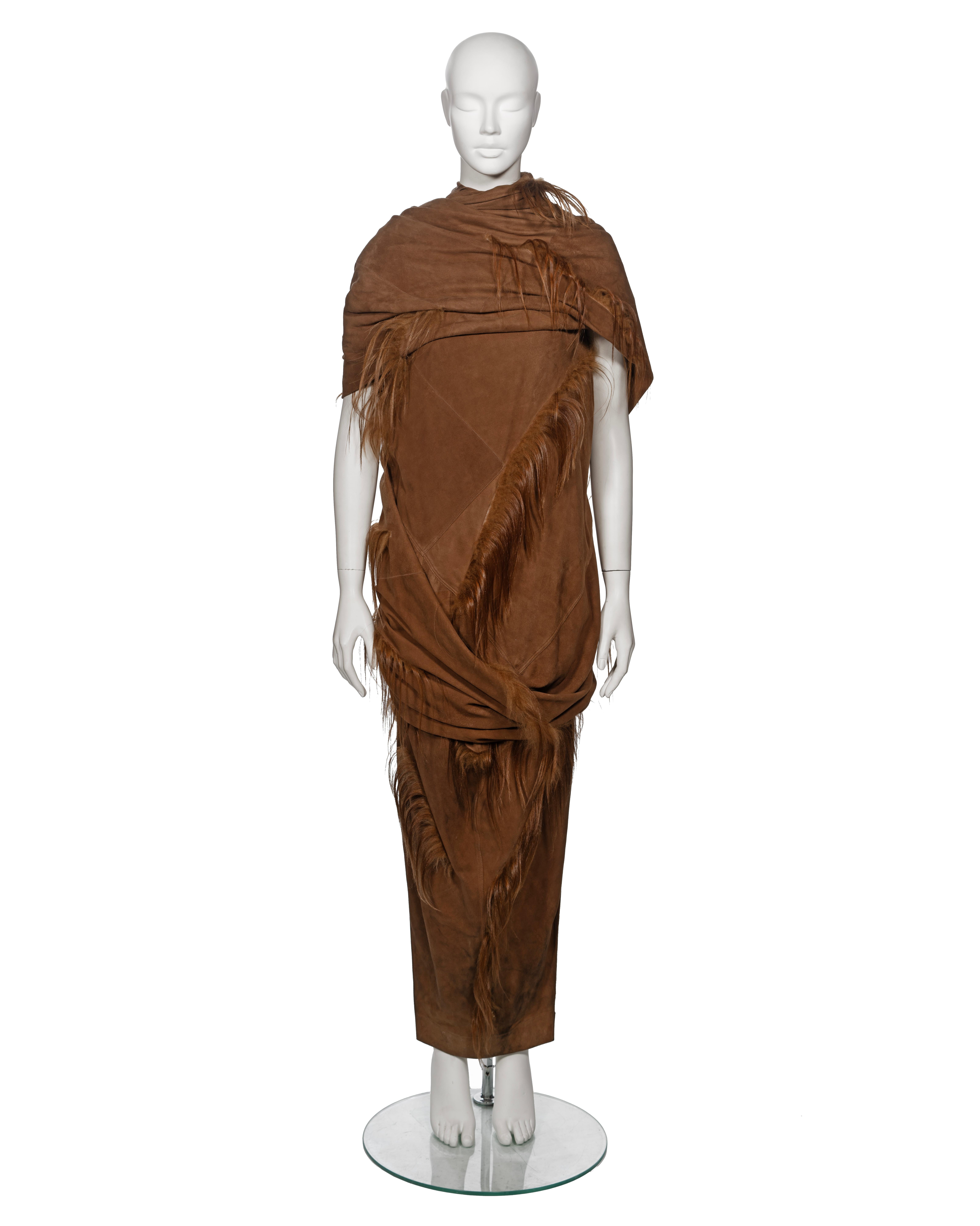 ▪ Archival Rick Owens 'Sphinx' Runway Ensemble 
▪ Fall-Winter 2015
▪ Crafted from multiple panels of chestnut suede
▪ Embellished with goat hair trimmings
▪ Asymmetric draped top boasts a high neck and expansive over-the-shoulder drape
▪ Accompanied