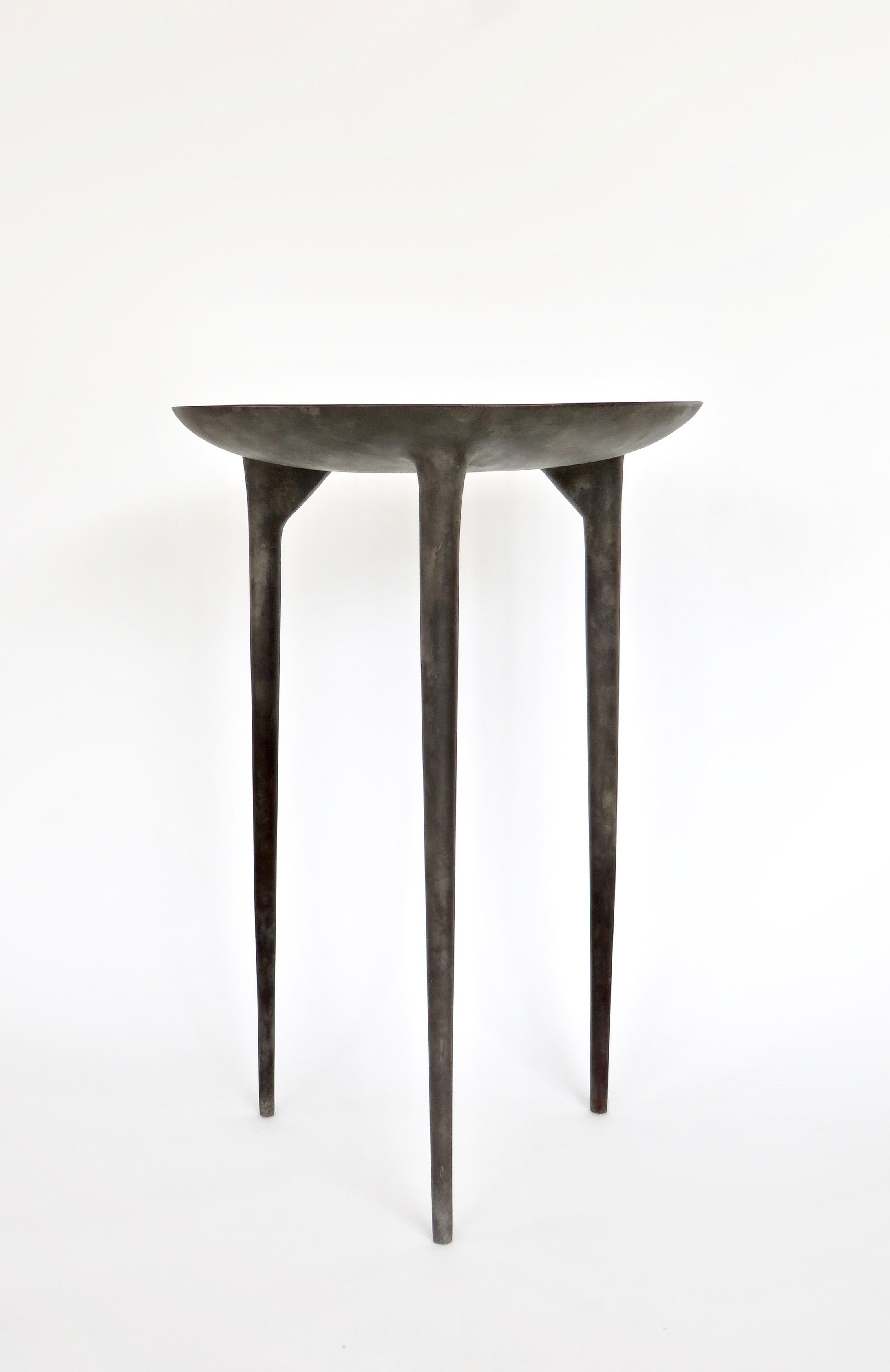 Handmade tall three-legged bronze brazier side table from the Rick Owens home collection. 'Tall Brazier' three-legged table in solid bronze with nitrate finish shown.
Signed Rick Owens. 
Also available in black finish by special order. 
Please note