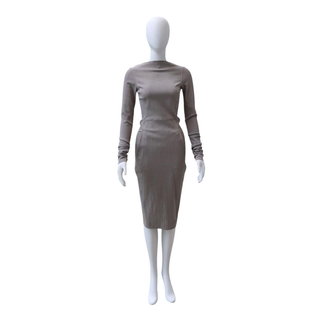 Rick Owens Long-Sleeved Draped Midi Bodycon Dress

A masterclass in modern minimalism, this Rick Owens midi dress features the designer’s signature sculptural silhouette with a draped waist detail, slim long sleeves, and a fitted pencil skirt. The