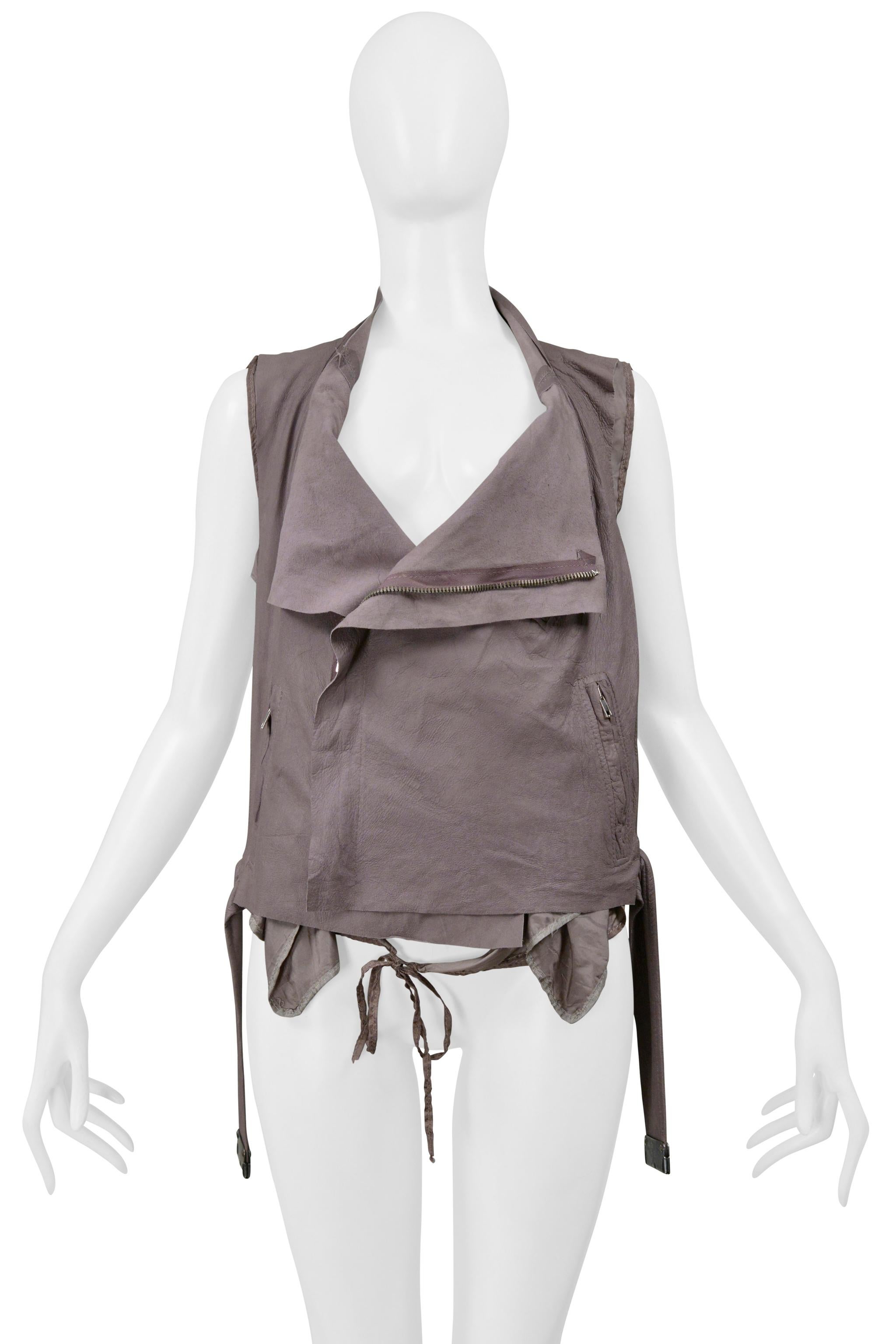 Resurrection Vintage is thrilled to offer a vintage Rick Owens mauve leather backless biker vest from the 2004 collection featuring a draped collar, side zippers, and a waistband at the hem.

Rick Owens
Size: 44
Fabric: 100% Sheep Leather, 100%