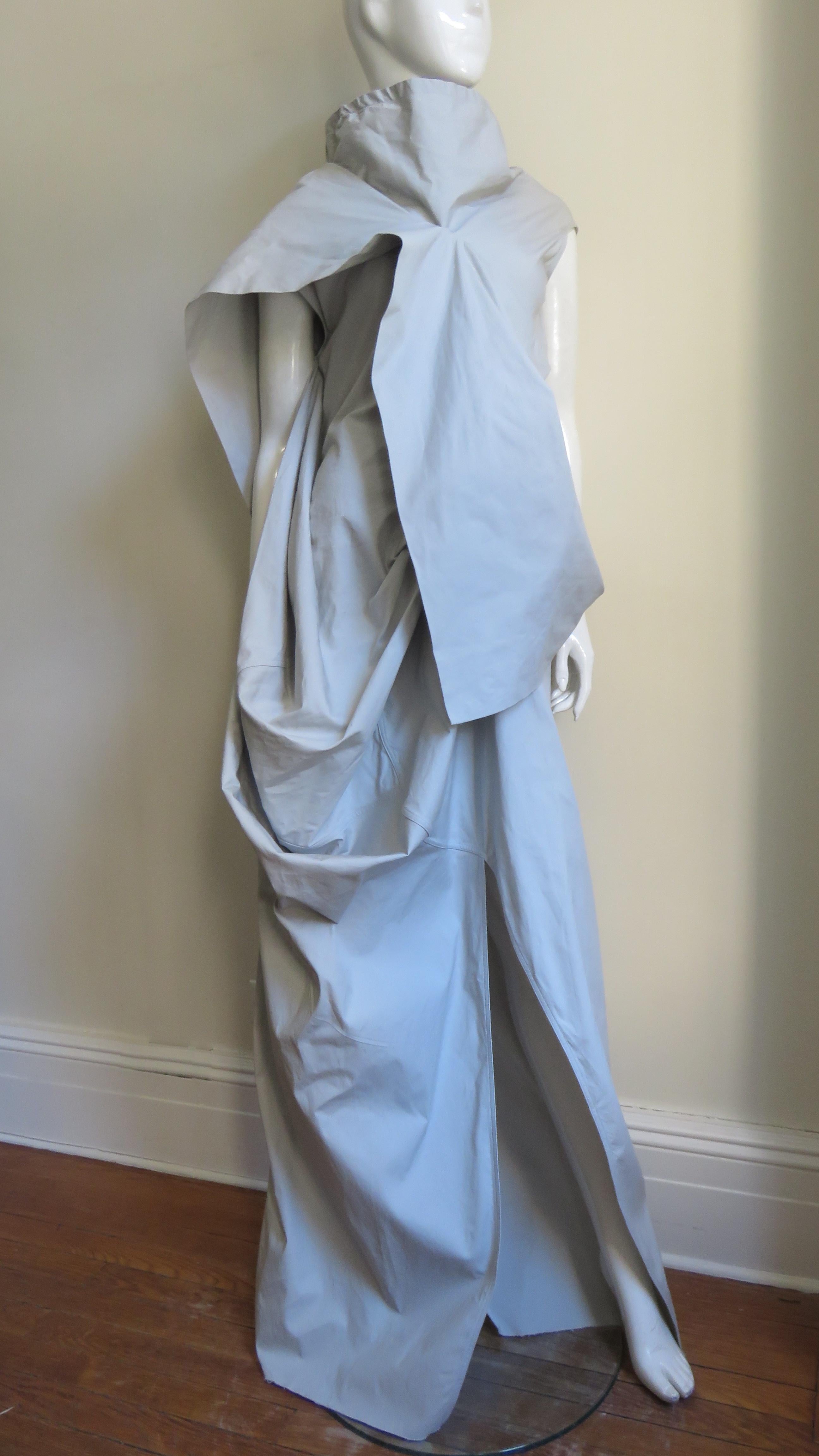 A fabulous pale taupe cotton with a bit of stretch maxi dress from avant garde master Rick Owens.  It is sleeveless with an adjustable stand up collar, a flap across the front and back bodice, draping at one side, and front and back slits in the