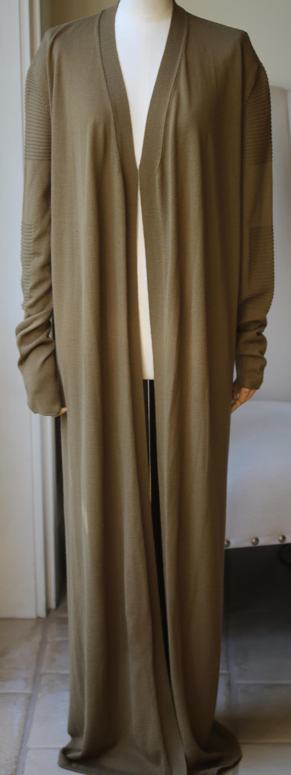If you don't yet own a maxi cardigan, Rick Owens' army-green style is sure to be all the persuading you need. It's finely knitted from pure merino wool that drapes beautifully and is really soft. Ribbed panels on the sleeves ensures it fits