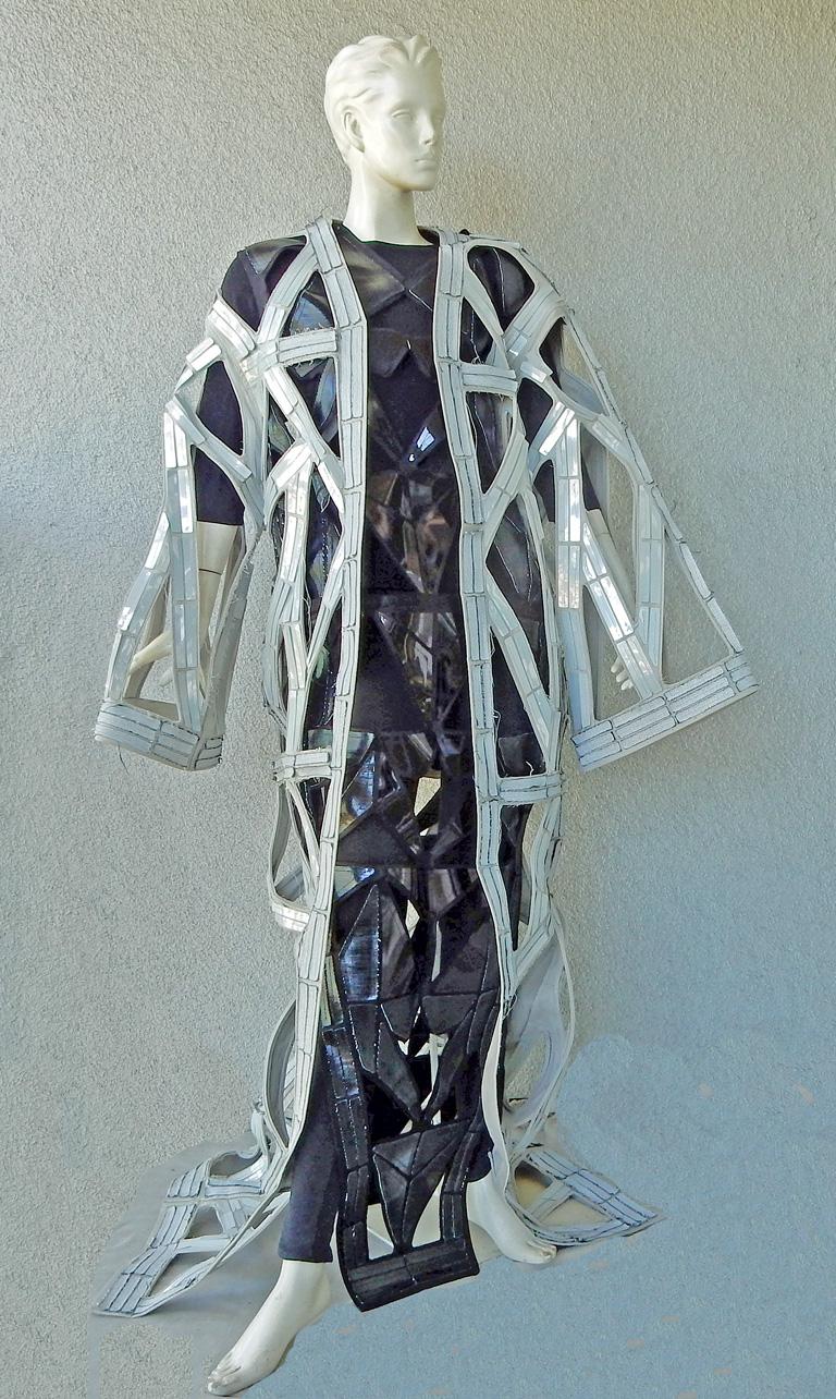 Many of the looks that made up the Rick Owens SS19 Babel collection were finished in geometric architectural sculptures.  A rare Rick Owens oversized runway coat.  fashioned of 