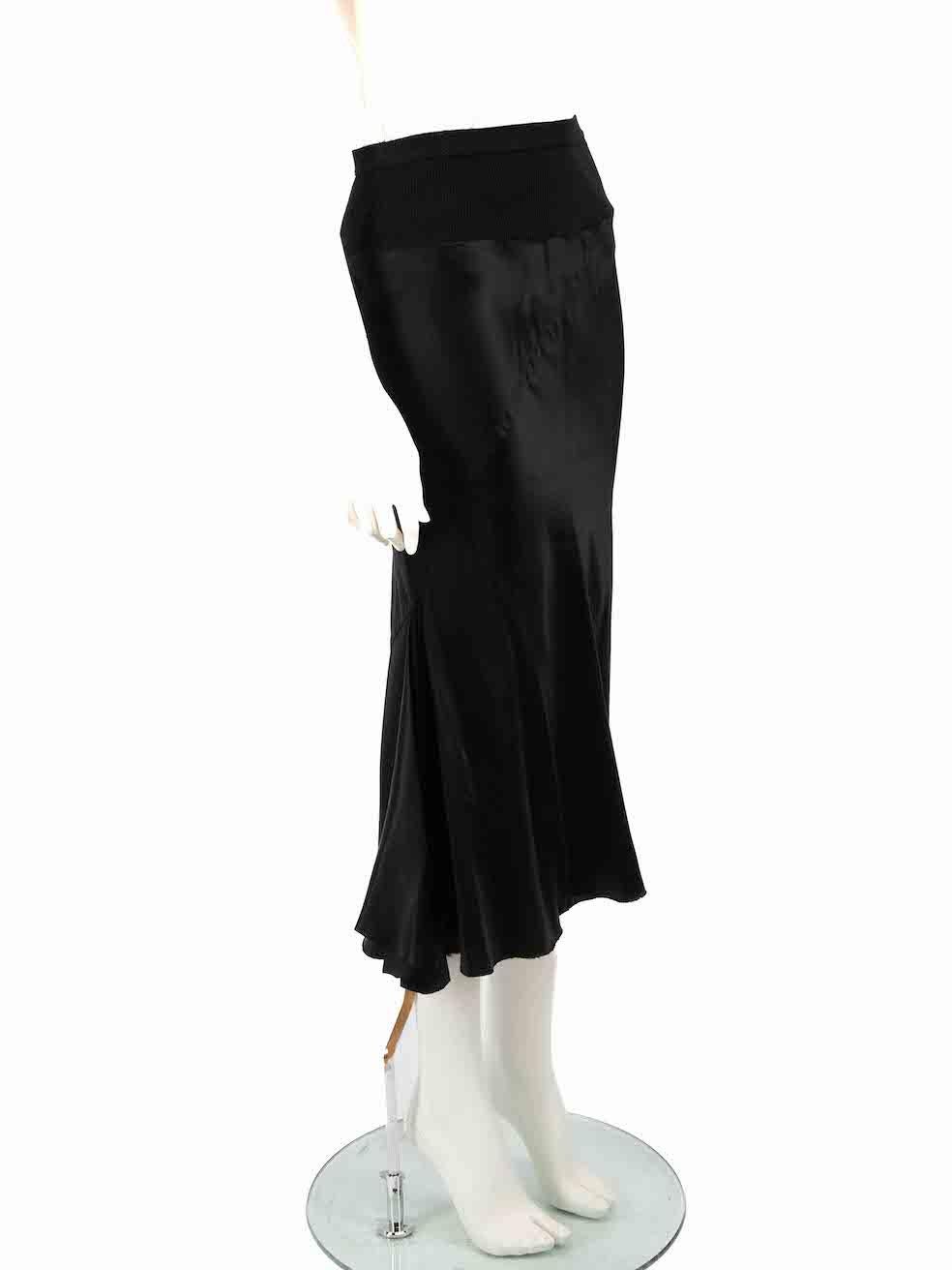 CONDITION is Good. Minor wear to skirt is evident. Light pulls to overall satin on this used Rick Owens designer resale item.
 
 
 
 Details
 
 
 Sisyphus F/W 18
 
 Black
 
 Cupro satin
 
 Skirt
 
 Midi
 
 Elasticated waistband
 
 Raw hem
 
 
 
 
 
