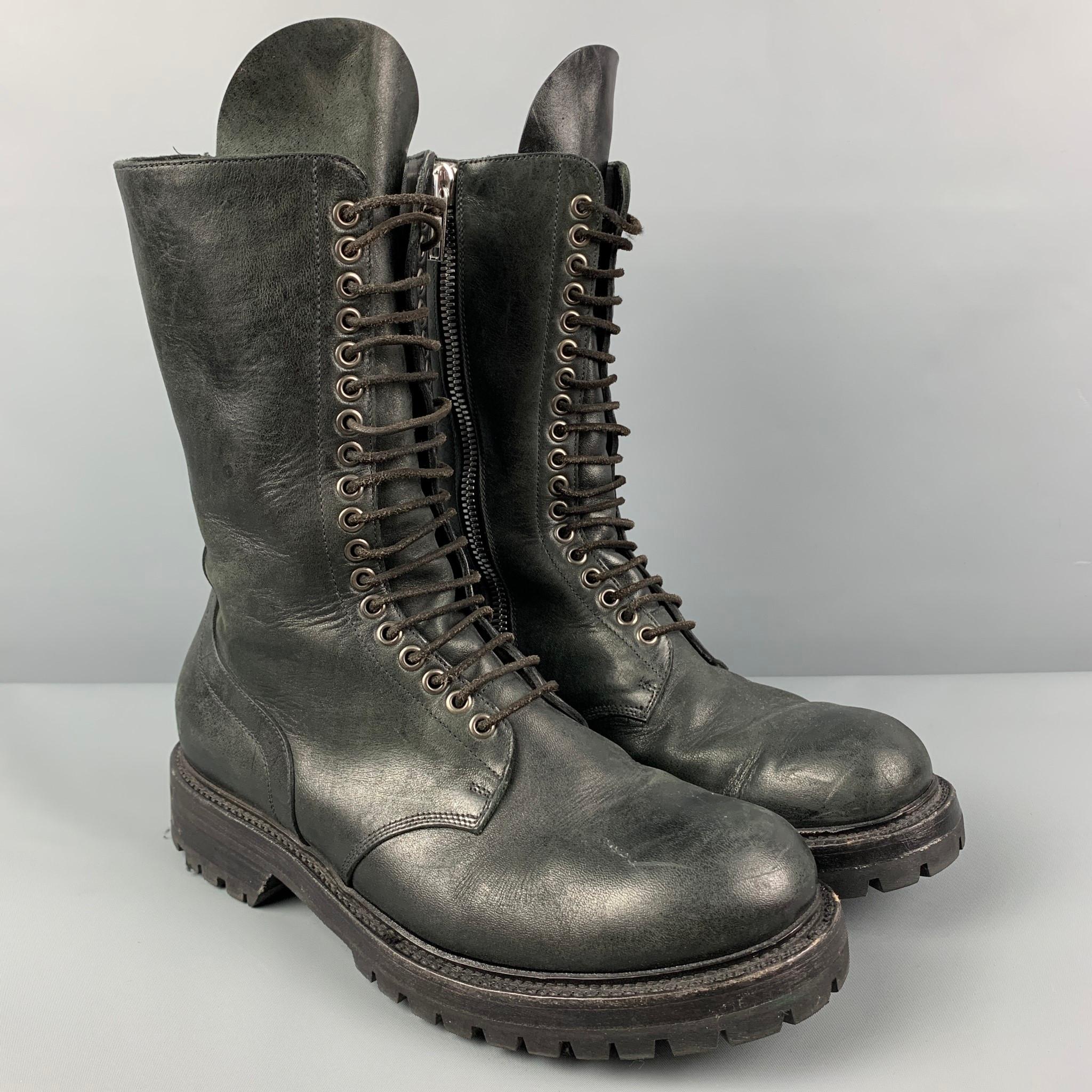 RICK OWENS boots comes in a black leather featuring a military style, round toe, side zipper detail, and a lace up closure. Includes dust bag. Made in Italy. 

Good Pre-Owned Condition. Minor wear. As-Is.
Marked: 43
Original Retail Price: