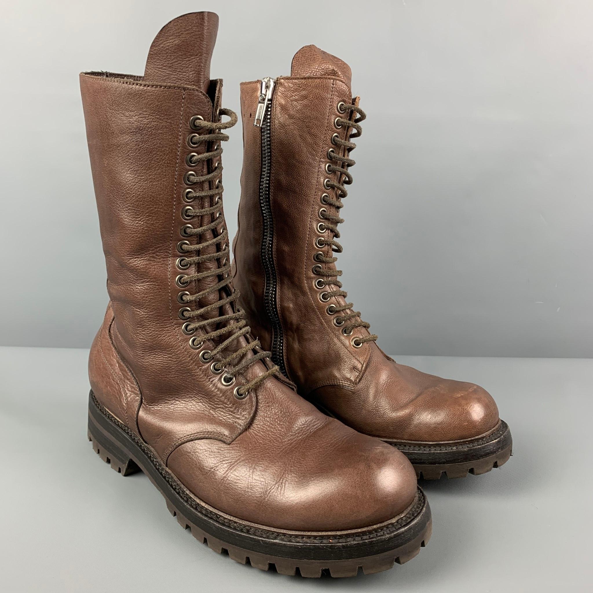 RICK OWENS boots comes in a brown leather featuring a military style, round toe, side zipper detail, and a lace up closure. Made in Italy. 

Good Pre-Owned Condition. Minor wear. As-Is.
Marked: 43
Original Retail Price: