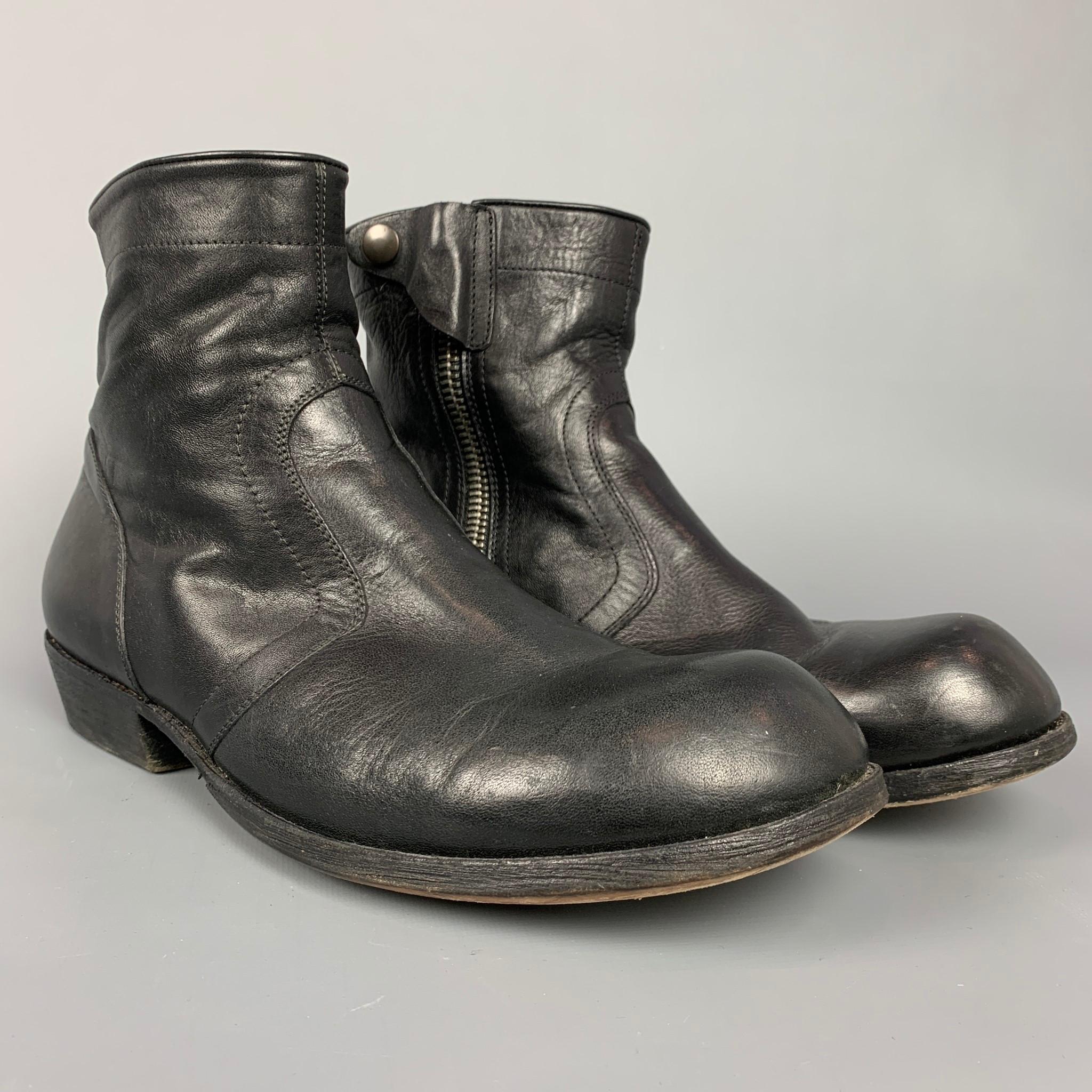 RICK OWENS boots comes in a black leather featuring a round toe, top stitching, snap button detail, and a side zipper closure. Made in Italy.

Very Good Pre-Owned Condition.
Marked: 44

Measurements:

Length: 11.5 in.
Width: 4 in.
Height: 7 in. 